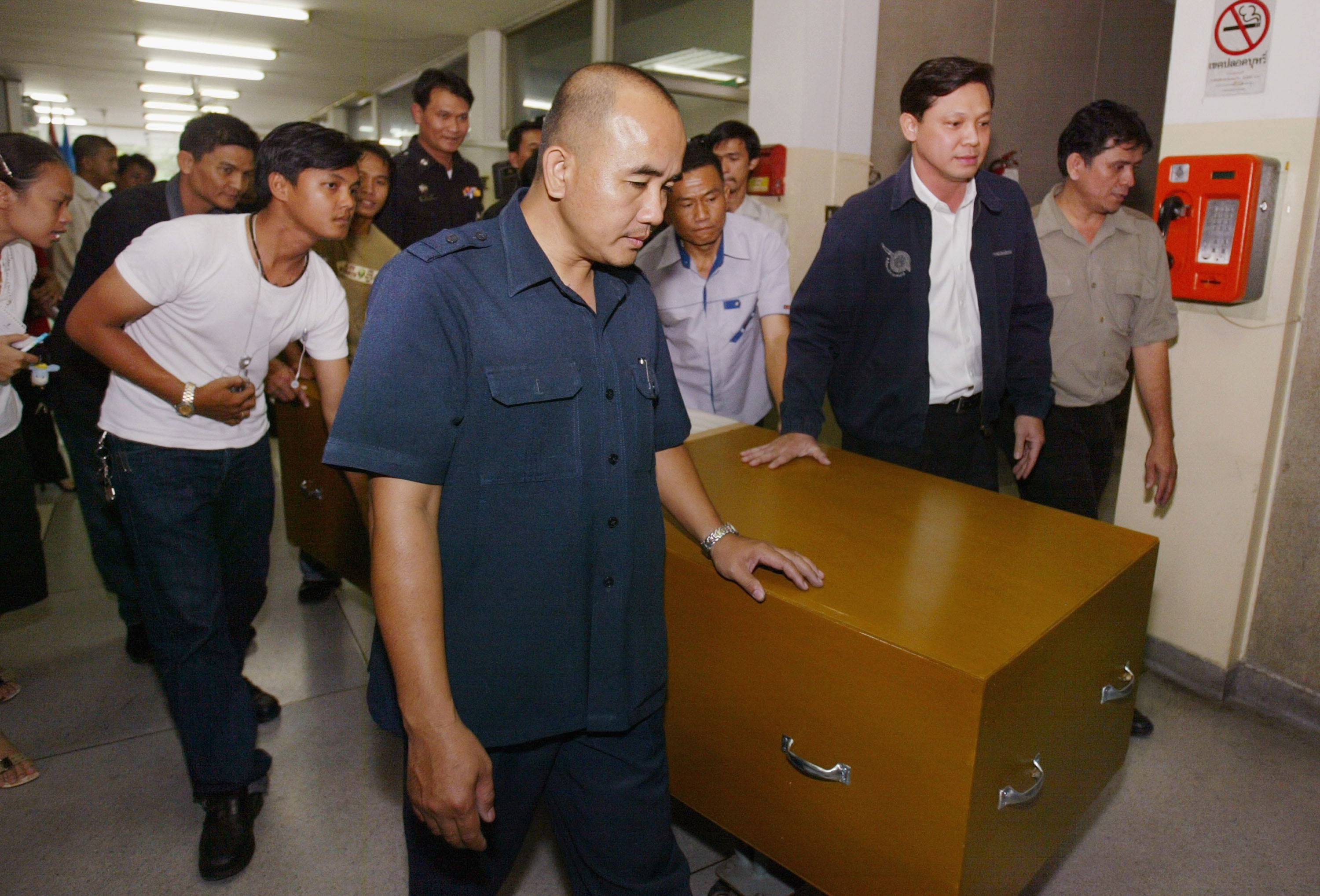 The casket of Vanessa Arscott, a 24-year-old British tourist who was murdered in Thailand with her boyfriend in 2004, is carried from a morgue to the airport for repatriation to the UK