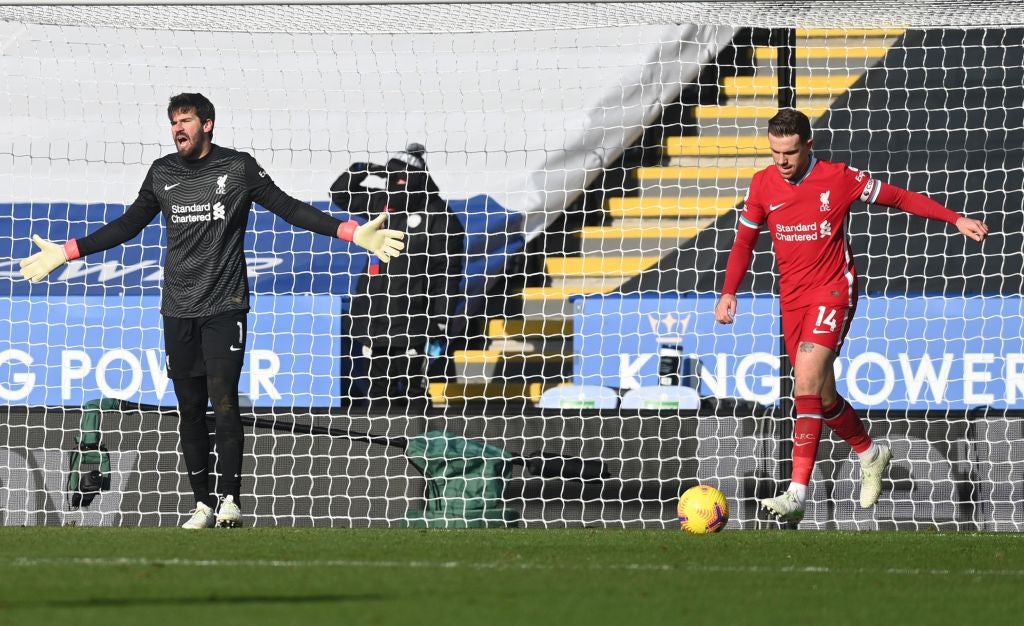 Alisson Becker and Jordan Henderson react to conceding