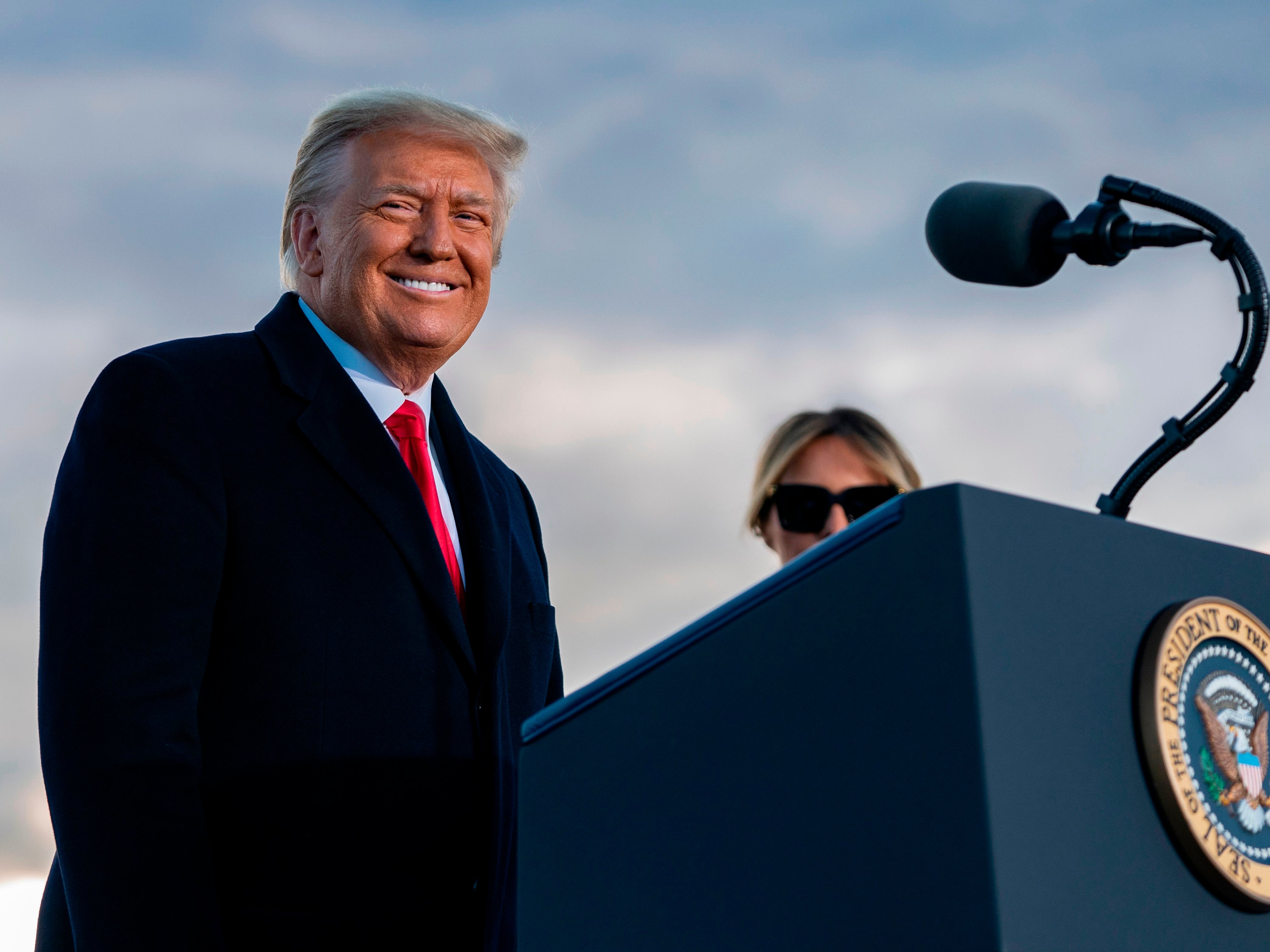 <p>Outgoing US President Donald Trump and First Lady Melania Trump address guests at Joint Base Andrews in Maryland </p>