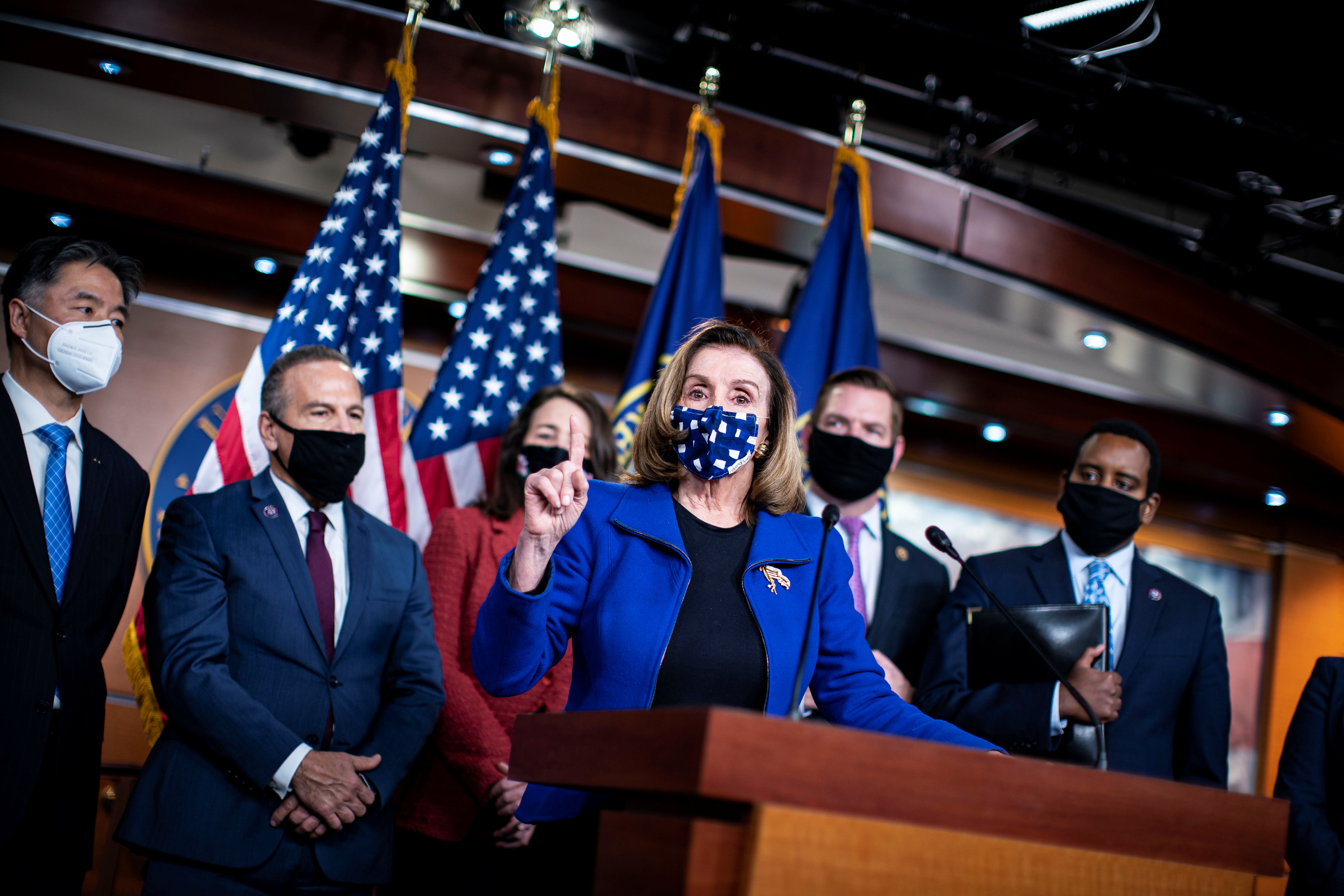 U.S. Speaker of the House Pelosi (D-CA) speaks during a news conference with House impeachment managers on the fifth day of the impeachment trial of former U.S. President Donald Trump