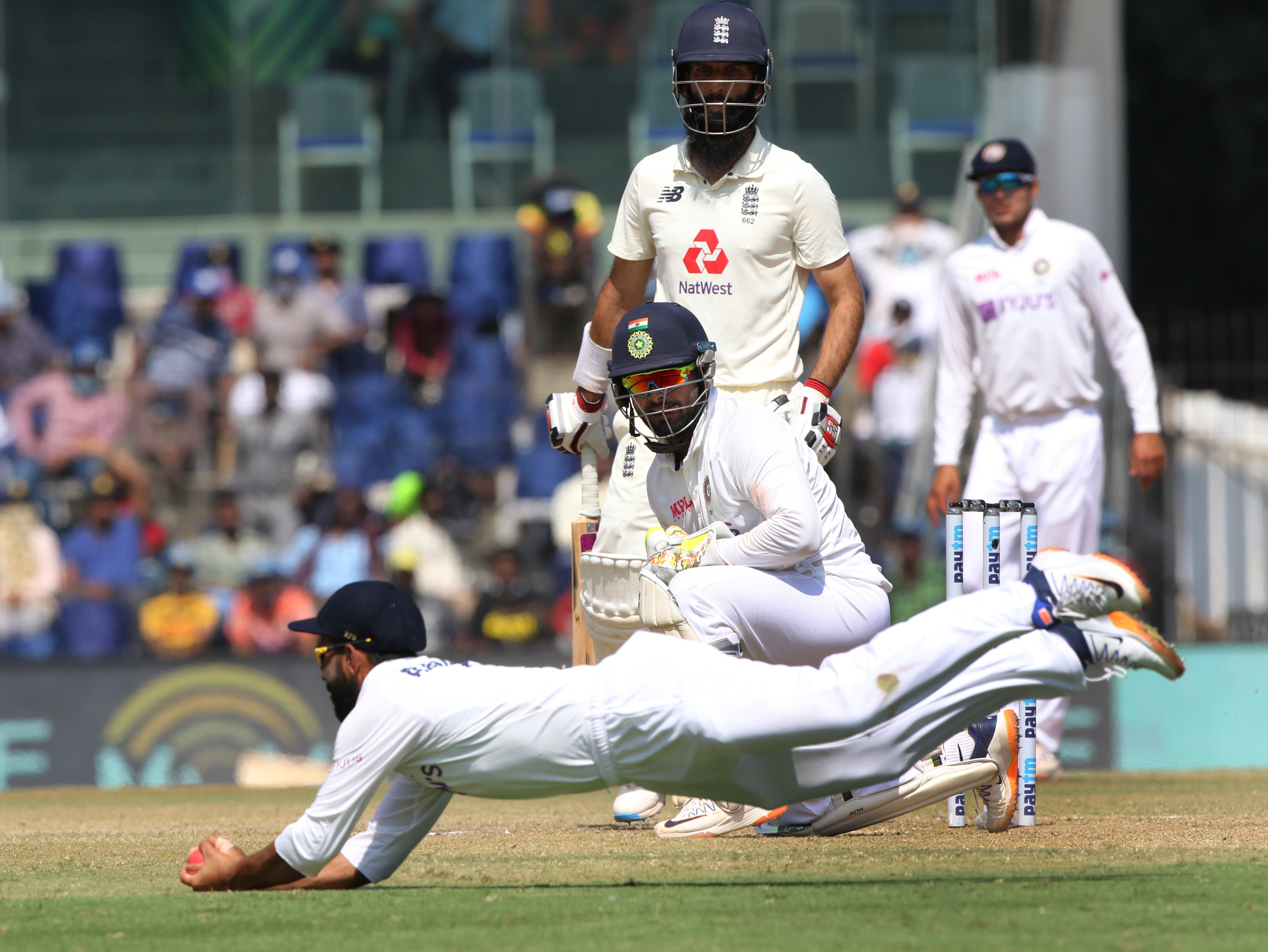 Ajinkya Rahane takes the catch to dismiss Moeen Ali