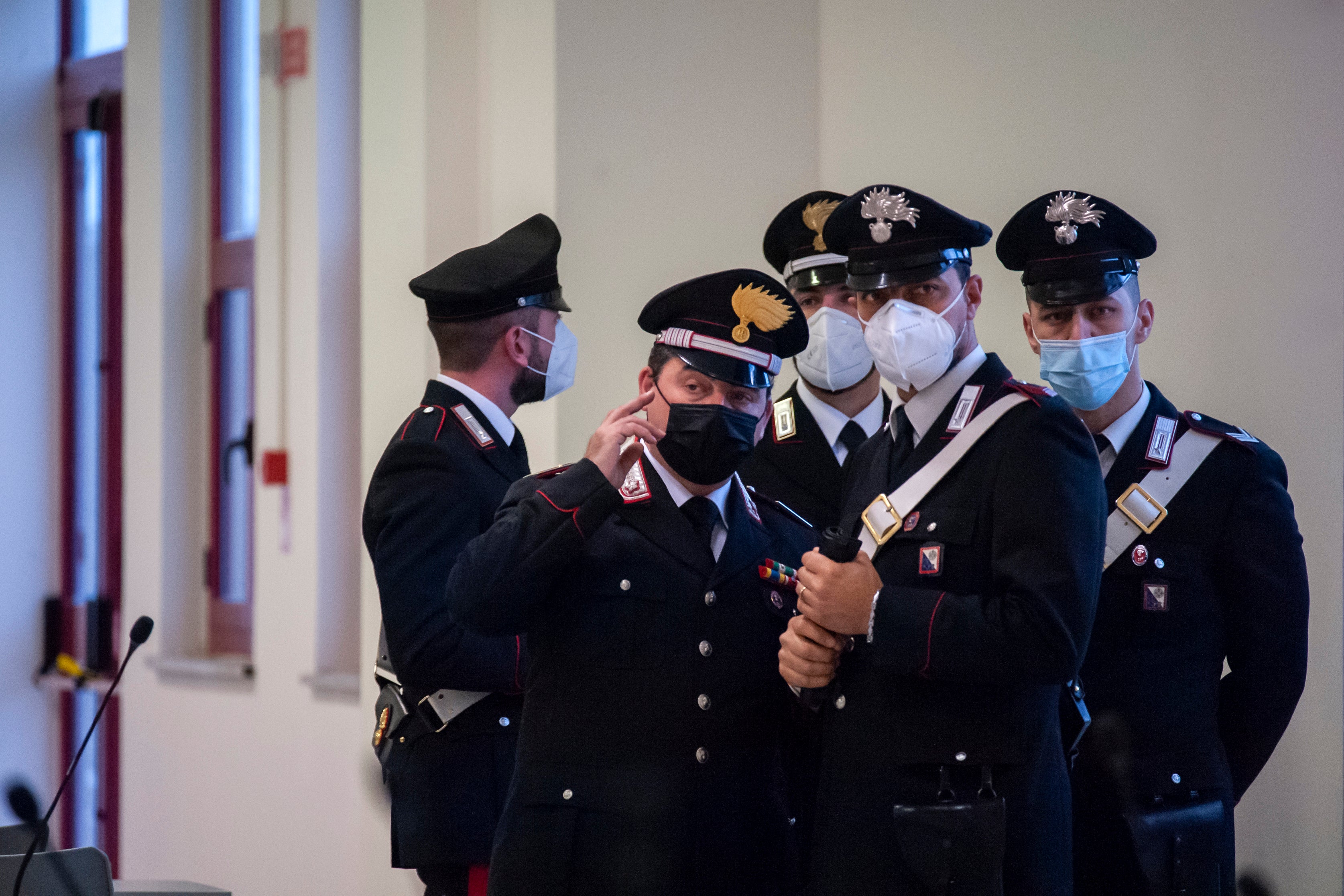 Police officers stand inside a specially constructed bunker hosting the first hearing of a maxi-trial against more than 300 defendants of the ’Ndrangheta crime syndicate in Calabria, southern Italy, last month