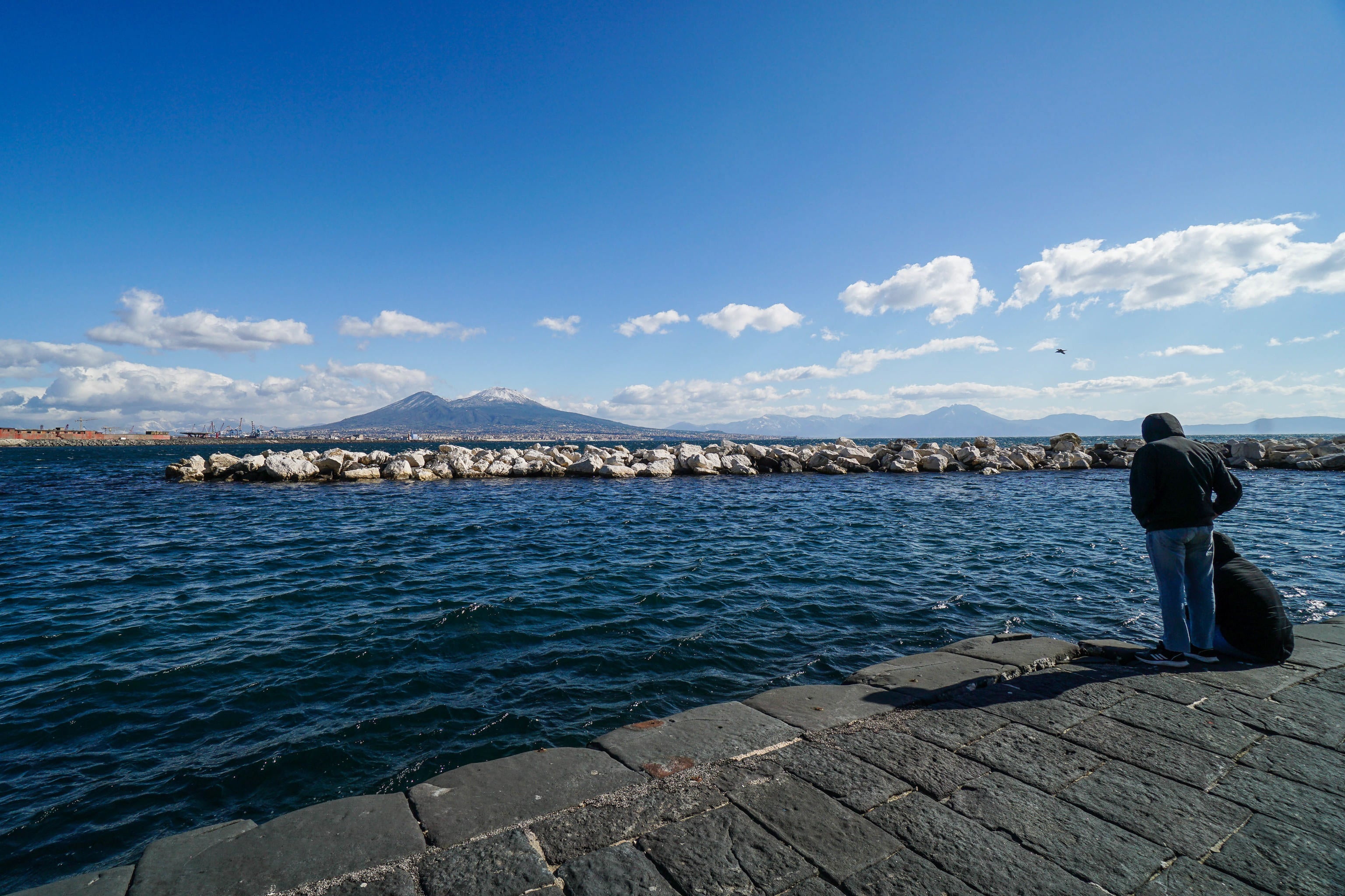 The snowy volcano Vesuvius. Naples is home to the Camorra syndicate