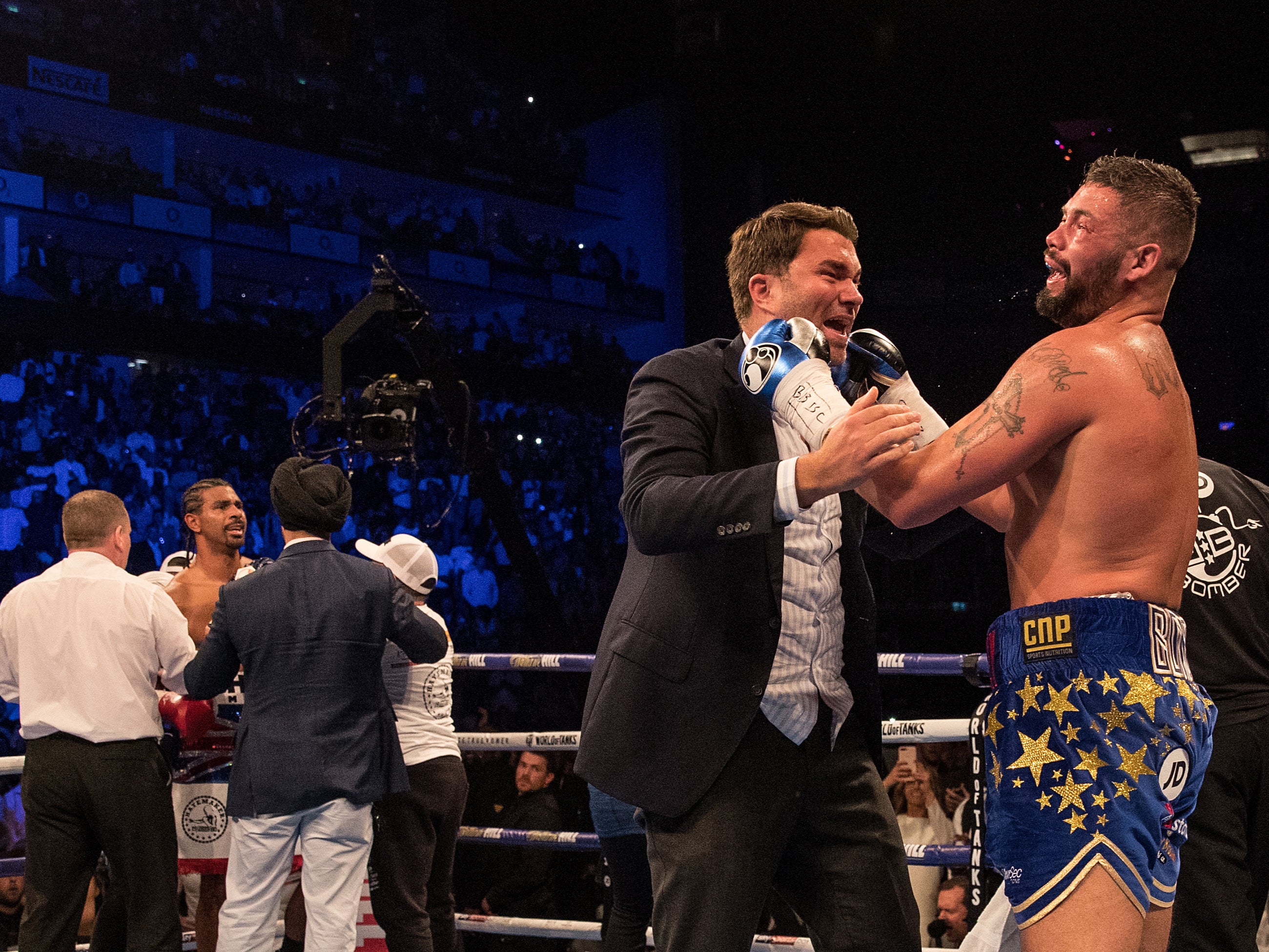 Bellew celebrates with promoter Eddie Hearn after beating David Haye for a second time