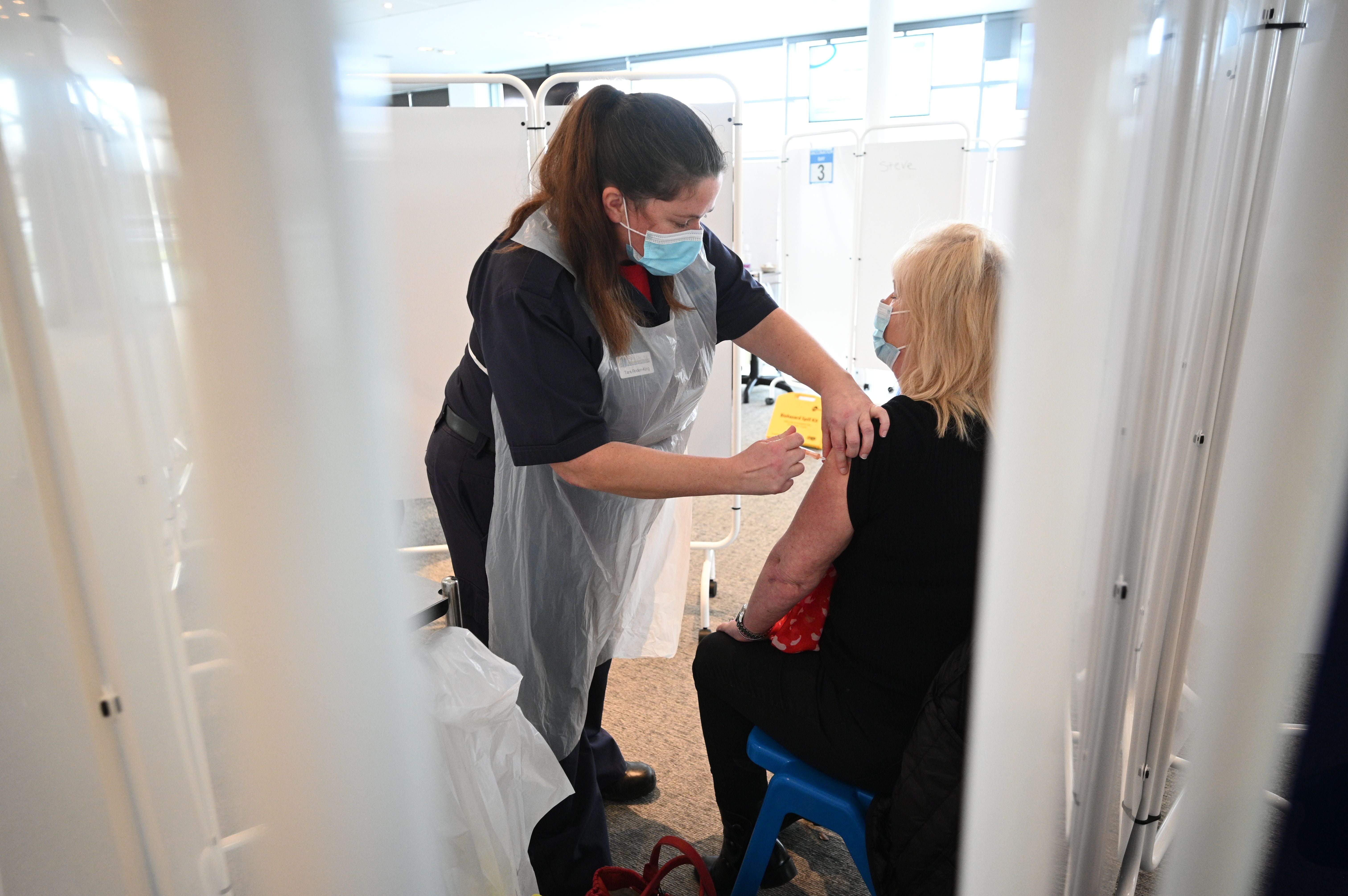 A woman receives the Oxford vaccine in Chester