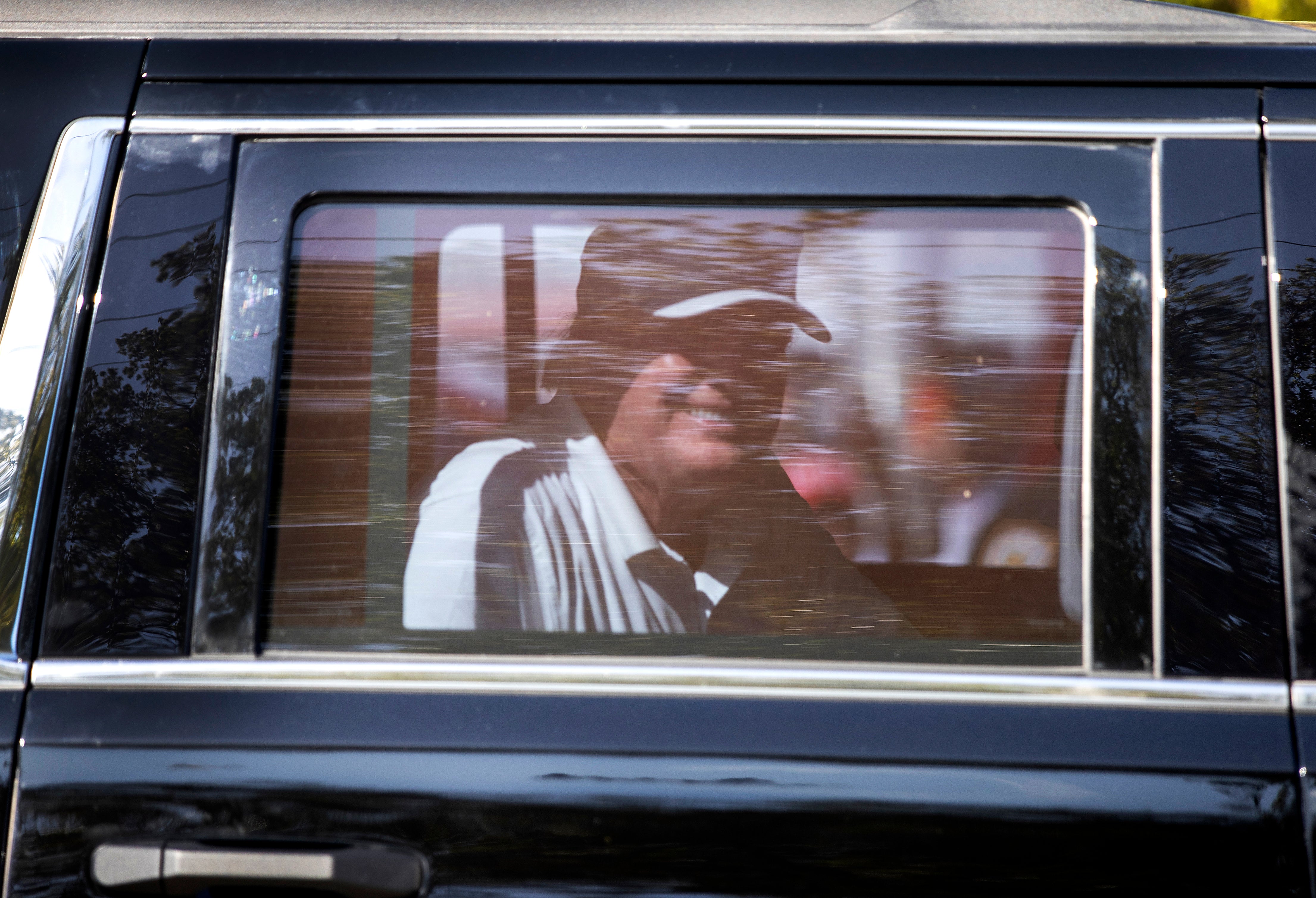 Trump drives past jubilant supporters at impromptu rally in Florida