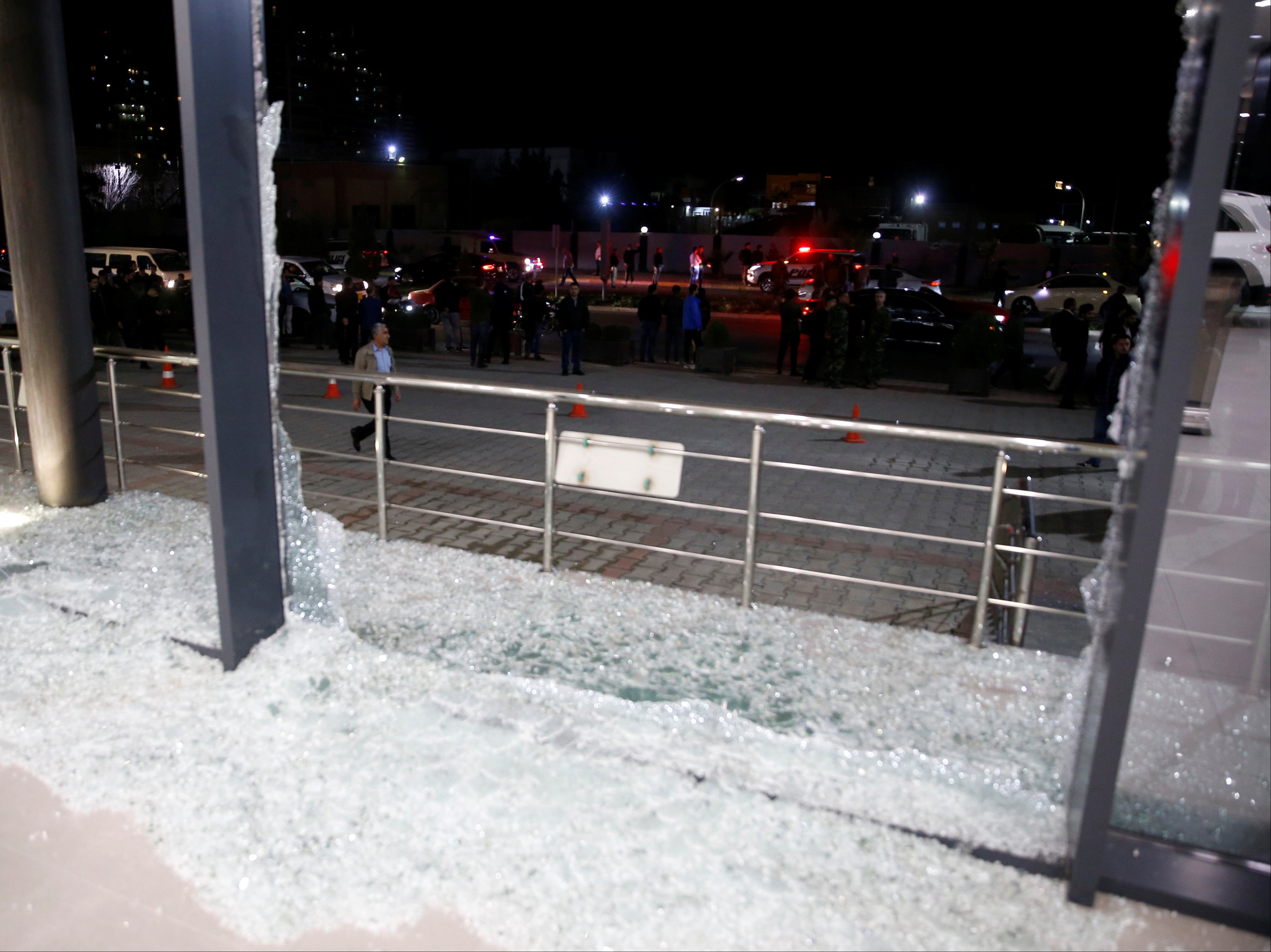 Broken glass at the Bright Castle Motors building following the rocket attack near Erbil airport