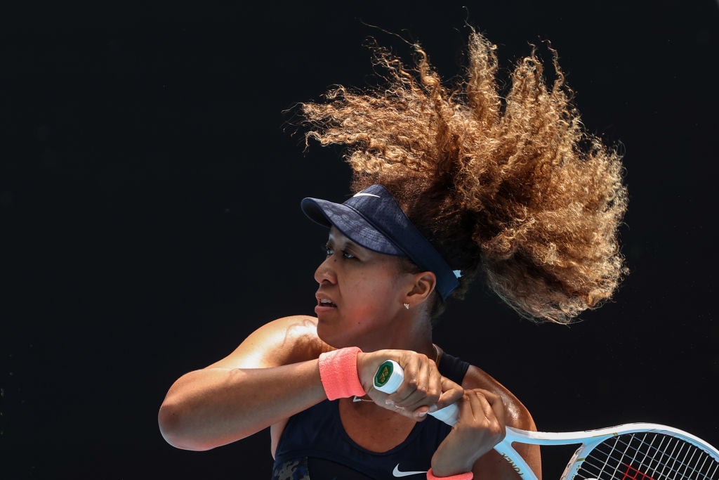 Naomi Osaka hits a return against Hsieh Su-wei