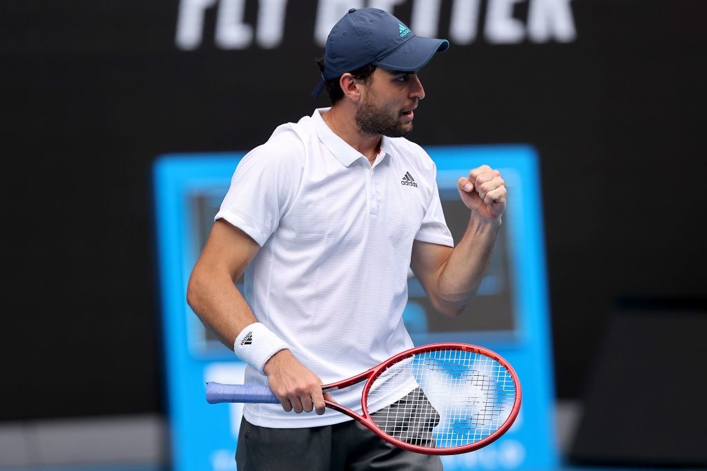 Aslan Karatsev celebrates against Grigor Dimitrov