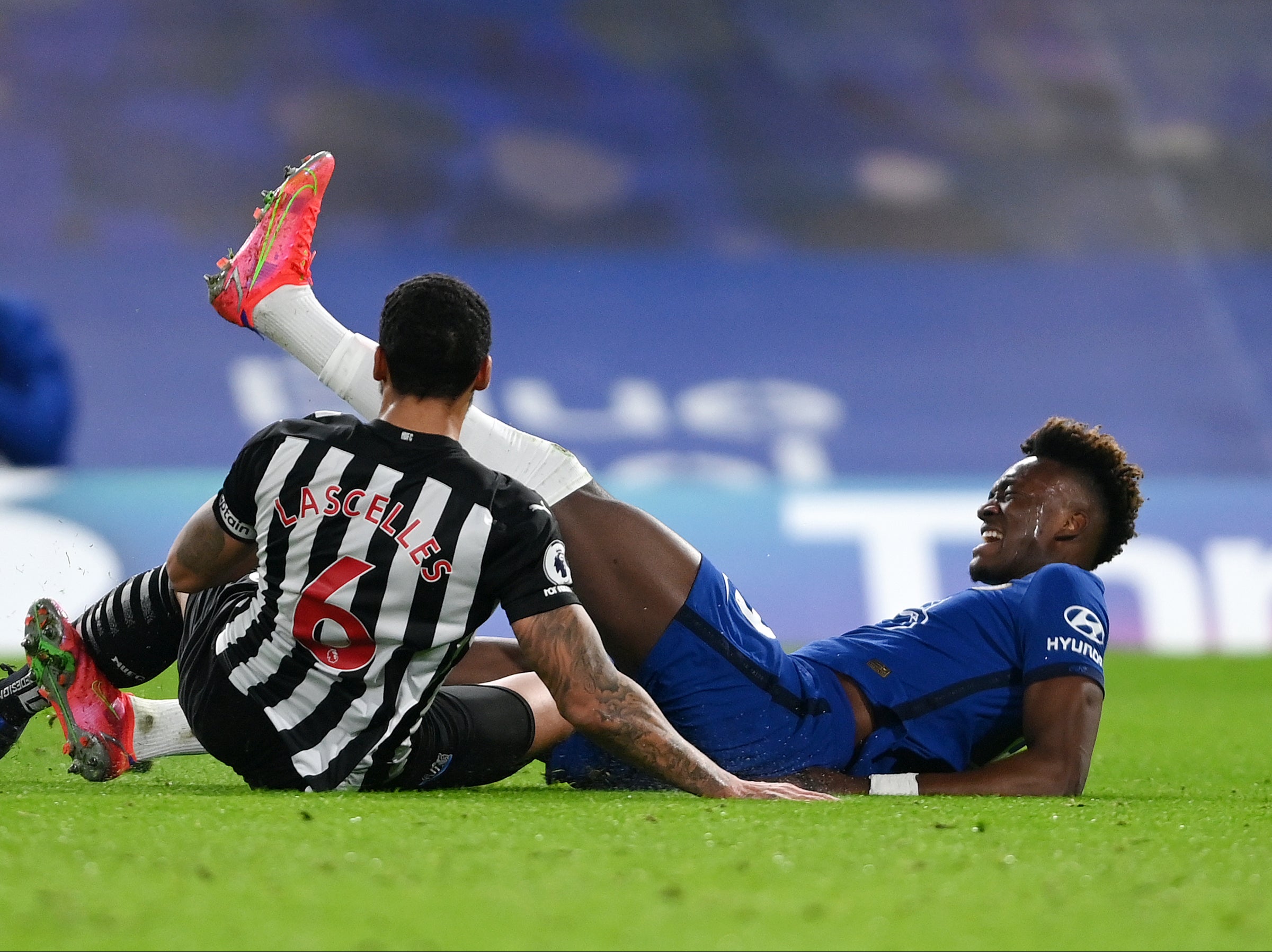 Jamaal Lascelles tackles Chelsea striker Tammy Abraham