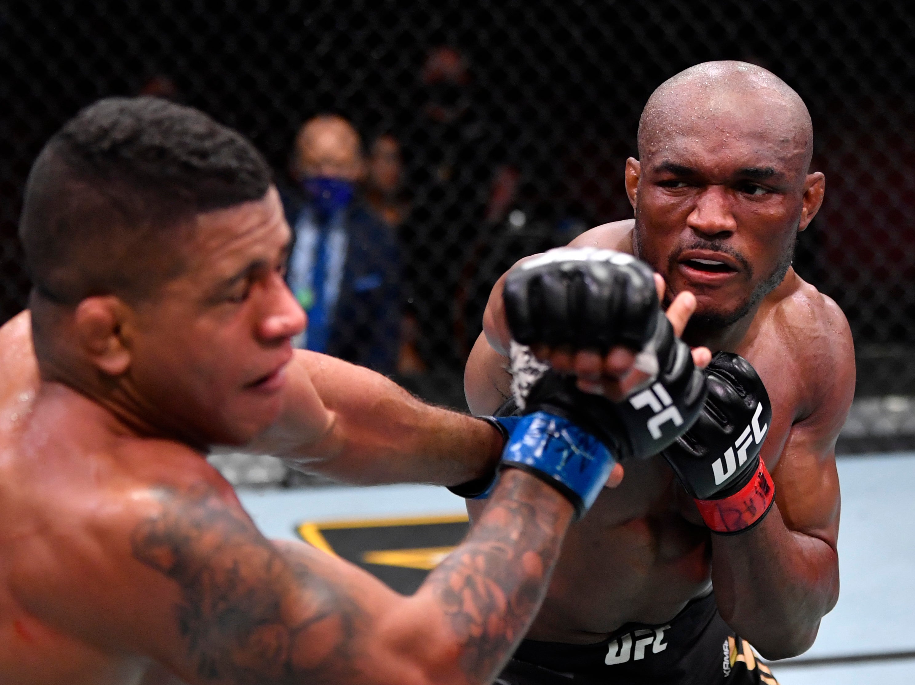 Kamaru Usman (right) stopped former team-mate Gilbert Burns at UFC 258