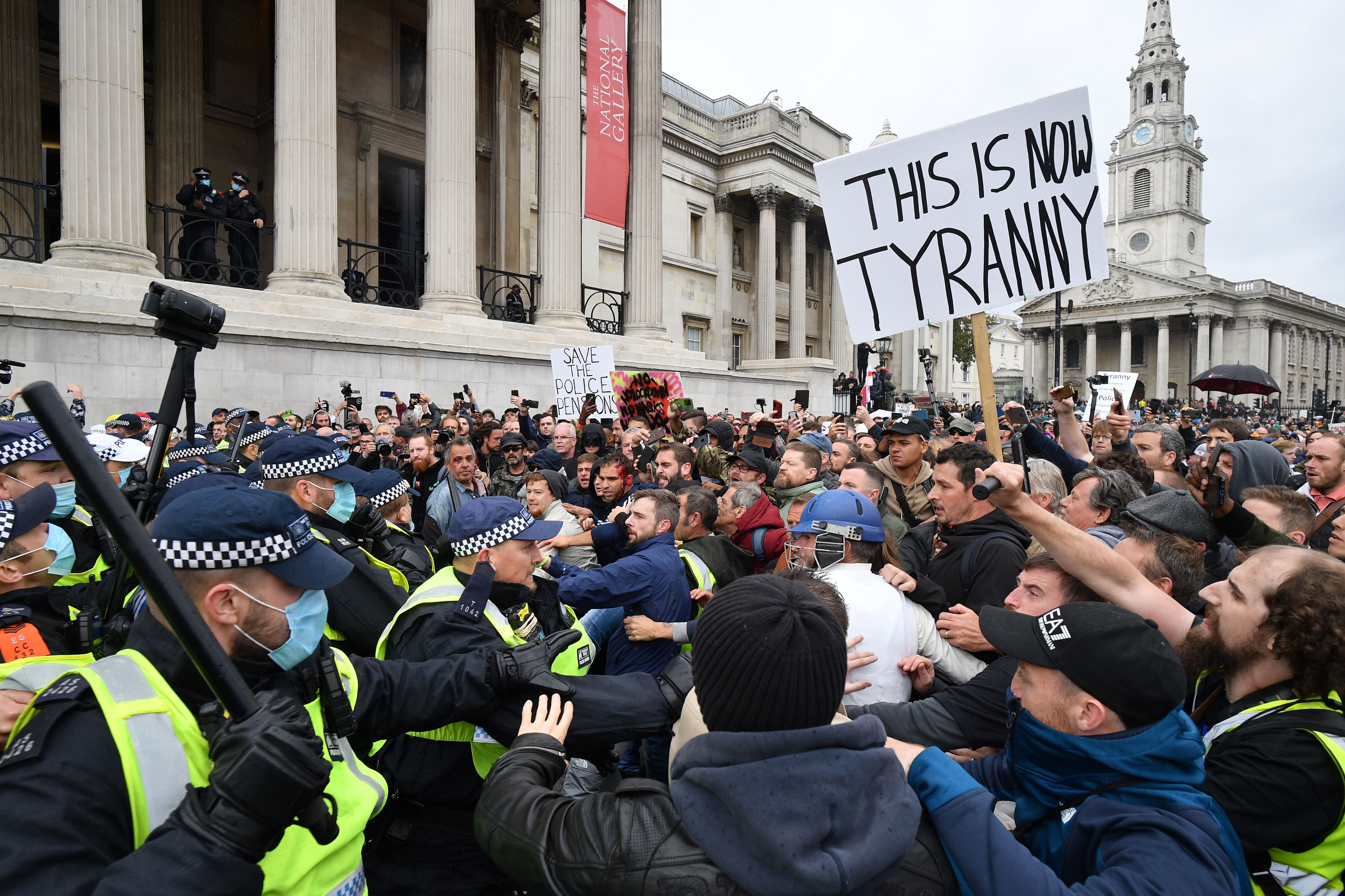 Police dispersing a mass rally against vaccination and Covid restrictions in Trafalgar Square in September