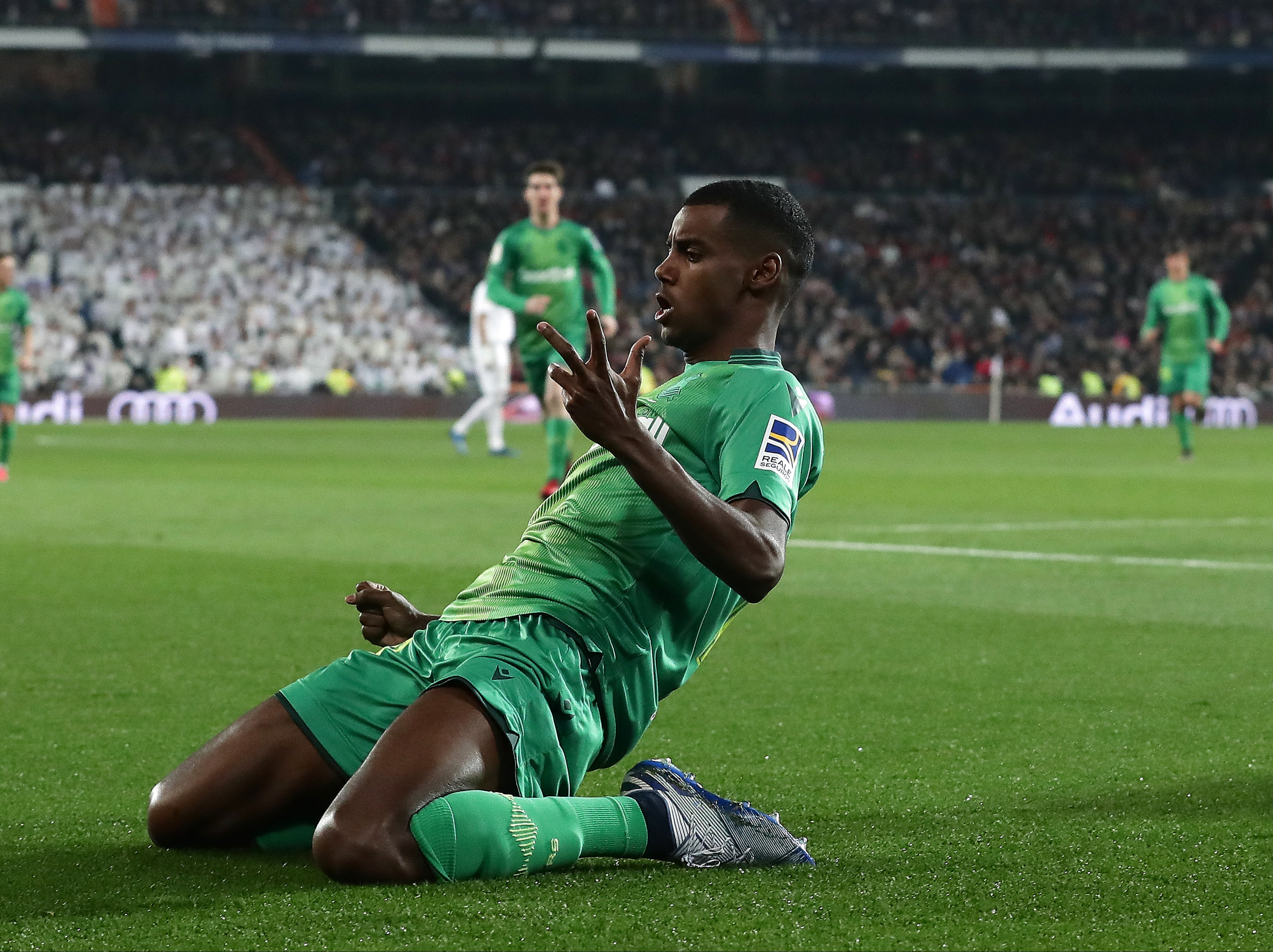 Alex Isak celebrates scoring against Real Madrid at the Bernabeu