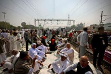 Farmers block trains in northern India to protest new laws