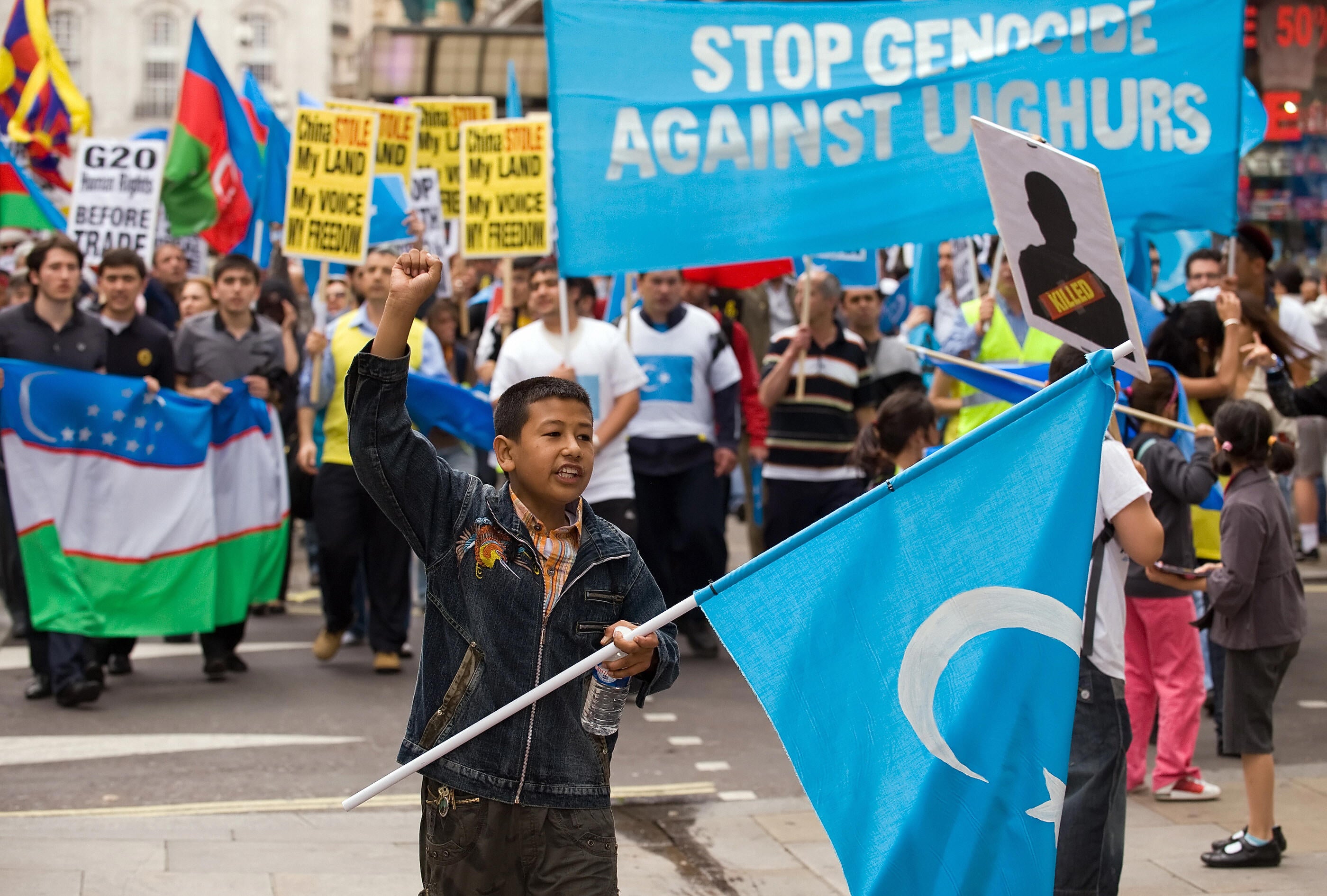 Young boy at anti Uighur genocide demostration in London