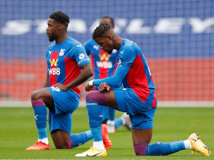 Wilfried Zaha takes the knee