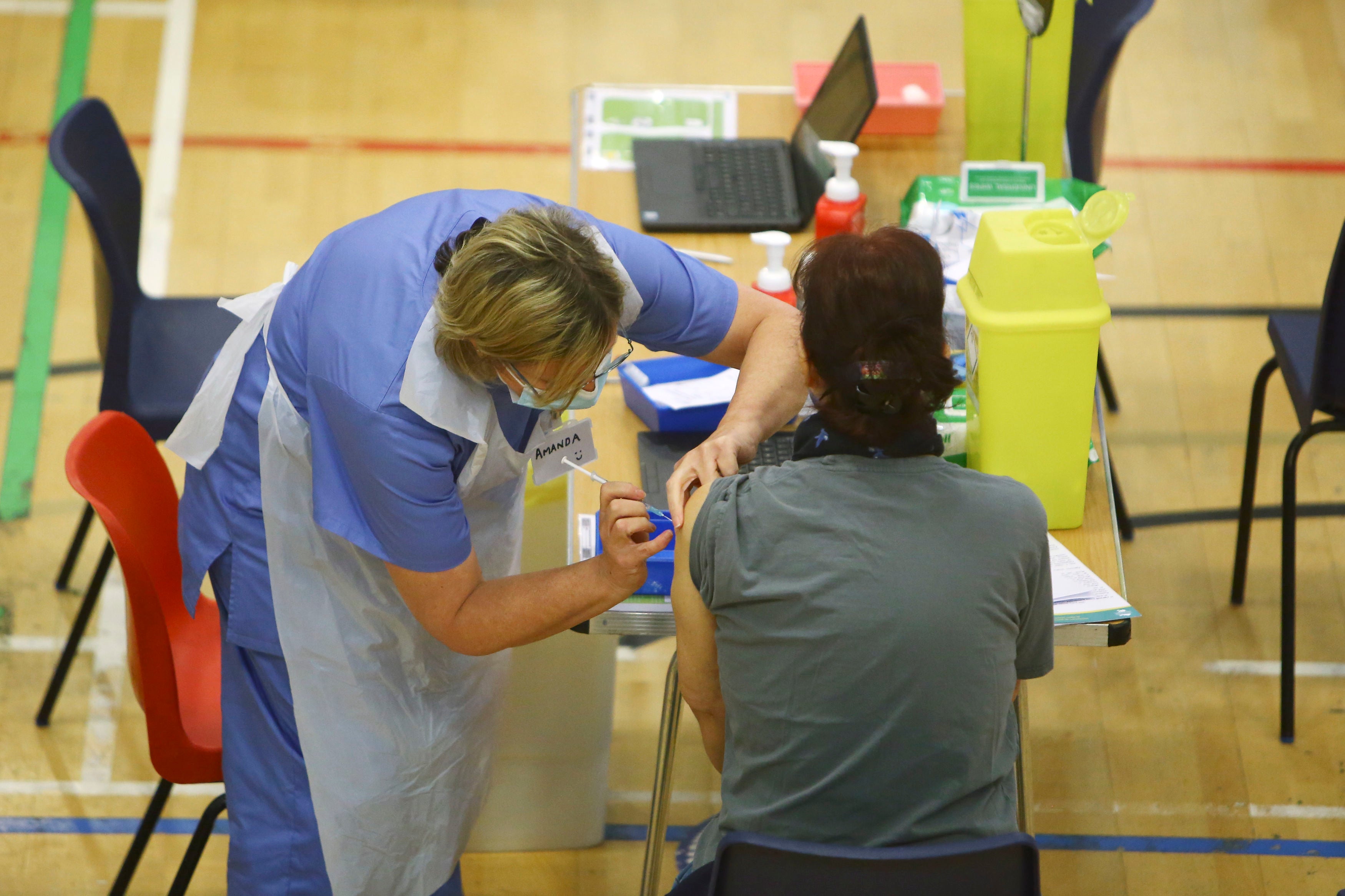 A member of the public receives the vaccine at Cwmbran Stadium in south Wales