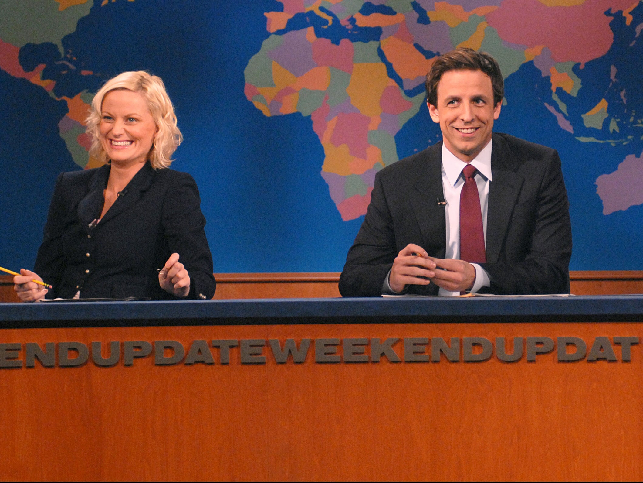 Poehler during her SNL days, presenting Weekend Update with Seth Meyers