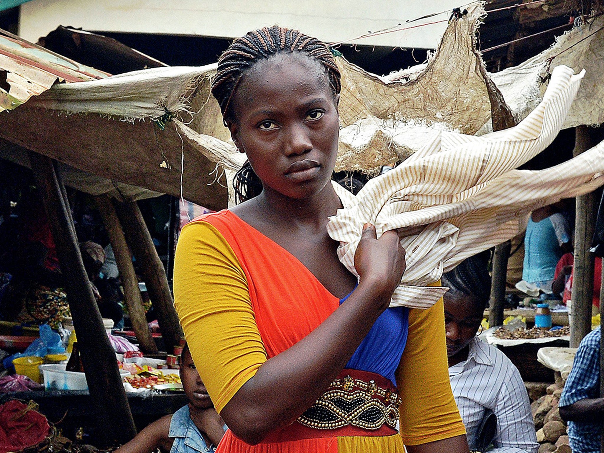 Women in Guinea bear the brunt of responsibilites at home and in the community