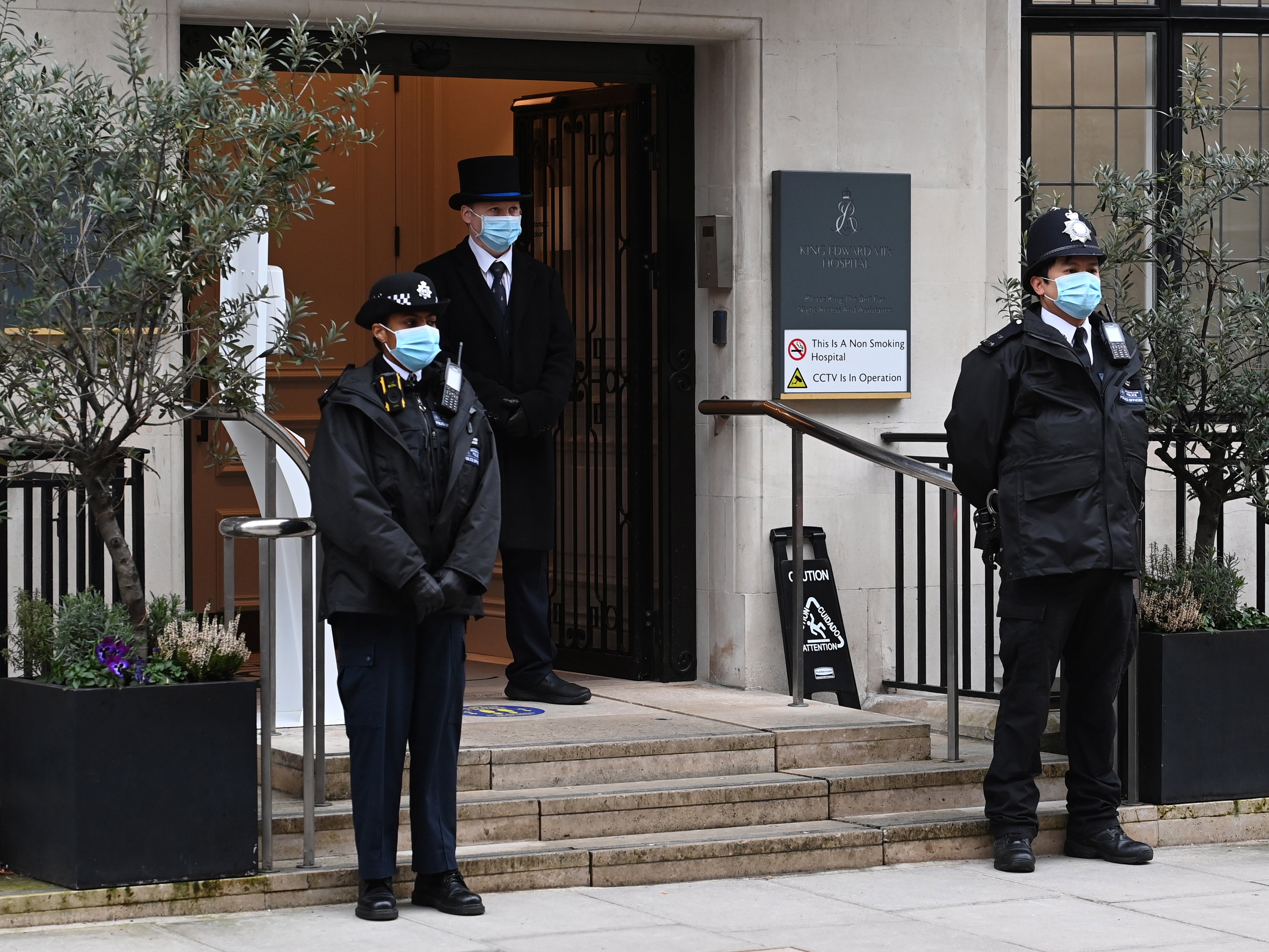 Police officers outside the hospital