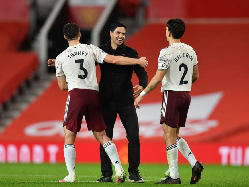 Mikel Arteta celebrates with Kieran Tierney and Hector Bellerin