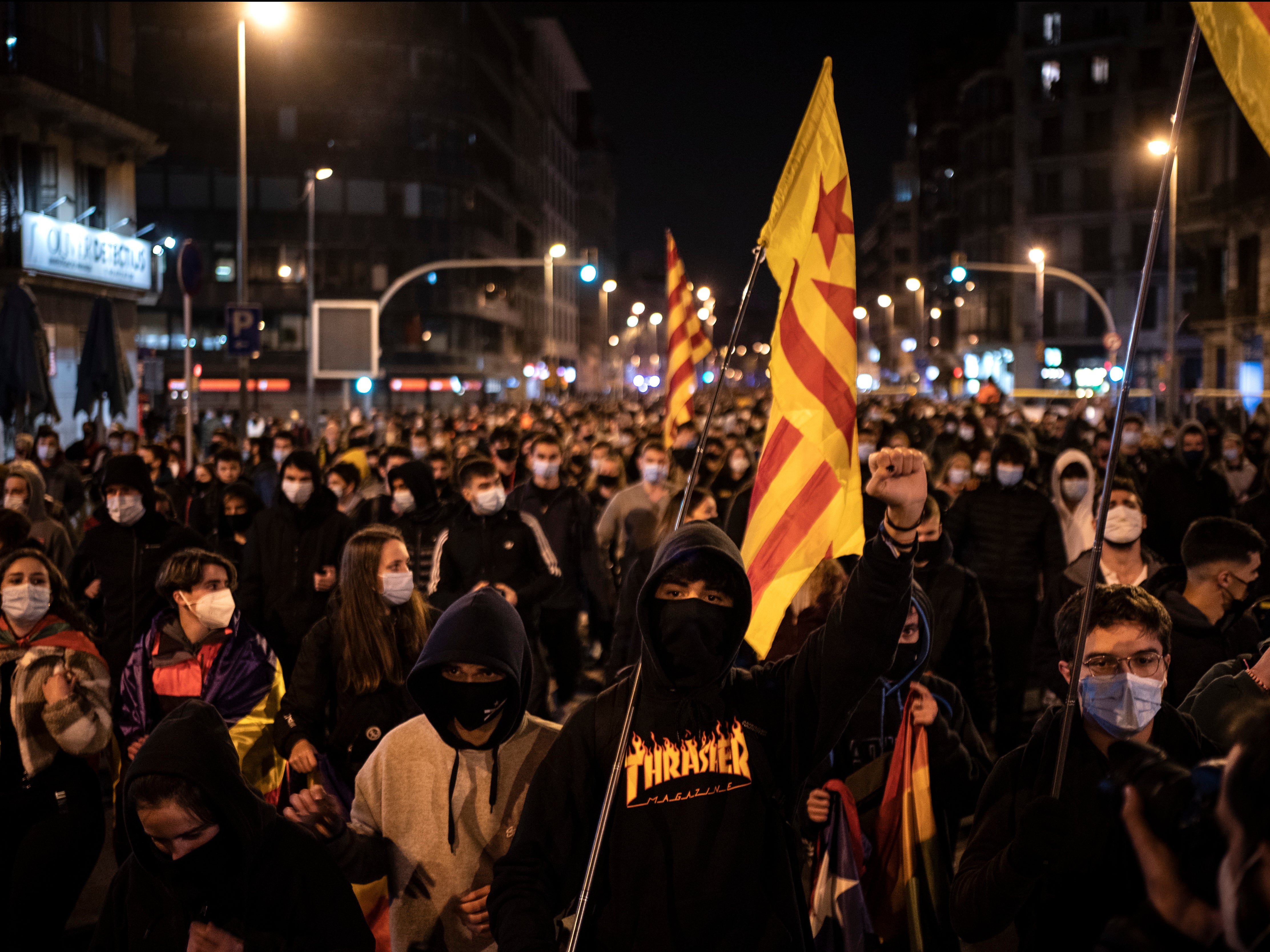 People march during a protest condemning the arrest of rap singer Pablo Hasél in Barcelona, Spain