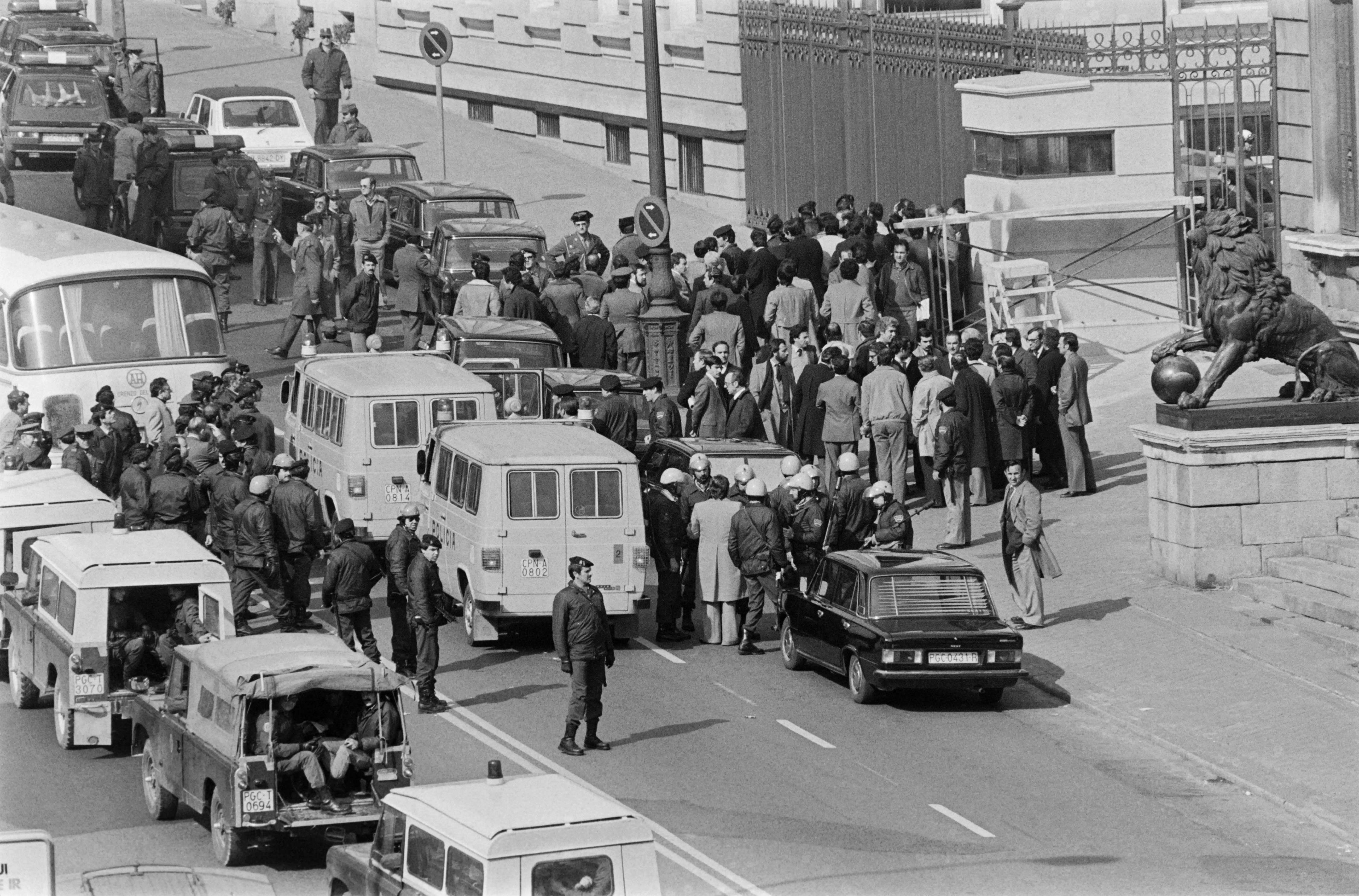 In this file photo taken on February 24, 1981 journalists, onlookers and civil guards wait for the release of deputies outside the parliament building in Madrid after an attempted right-wing coup