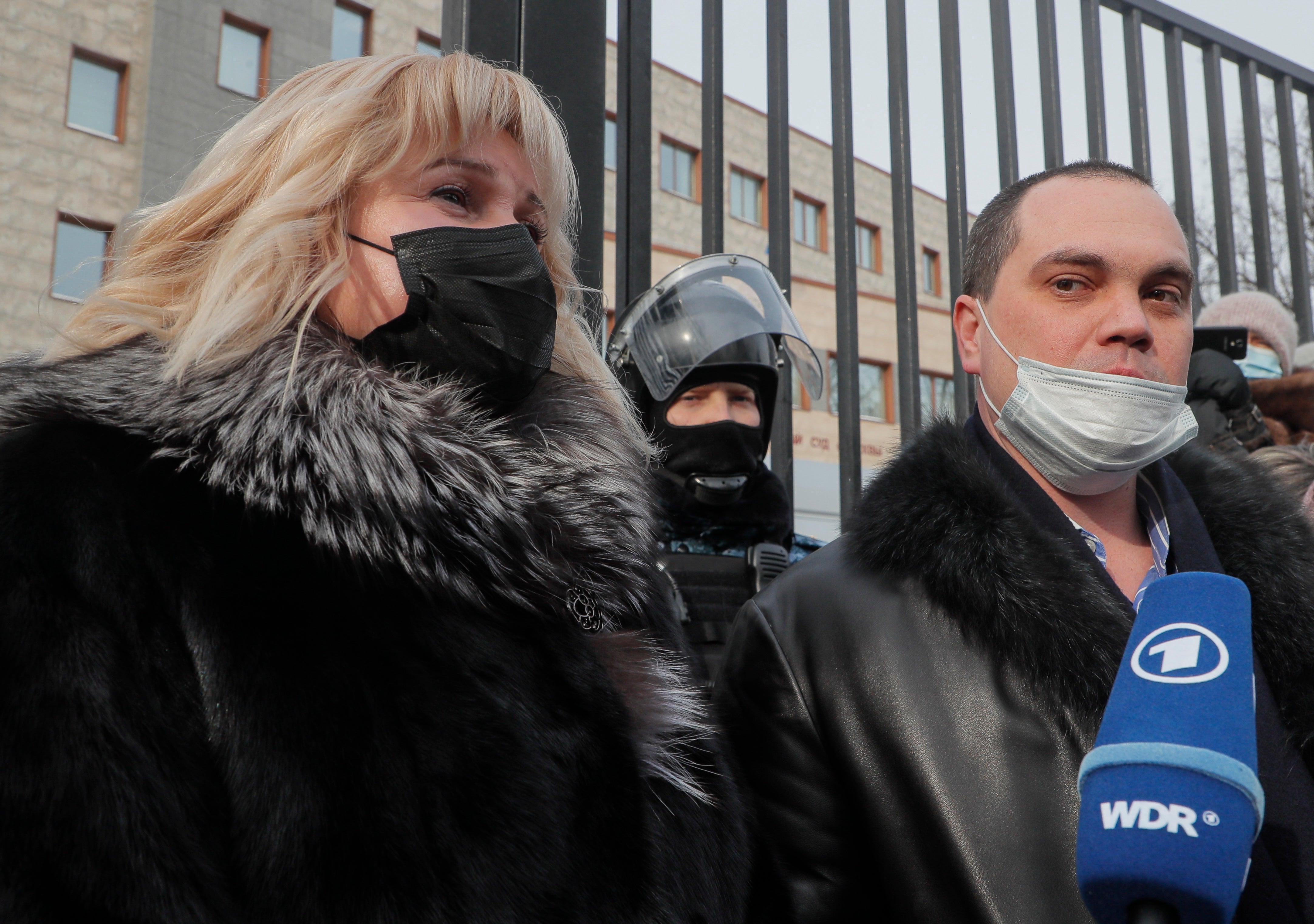 Lawyers for Alexei Navalny, Olga Mikhailova (left) and Vadim Kobzev, speak to reporters outside the Moscow court on Saturday