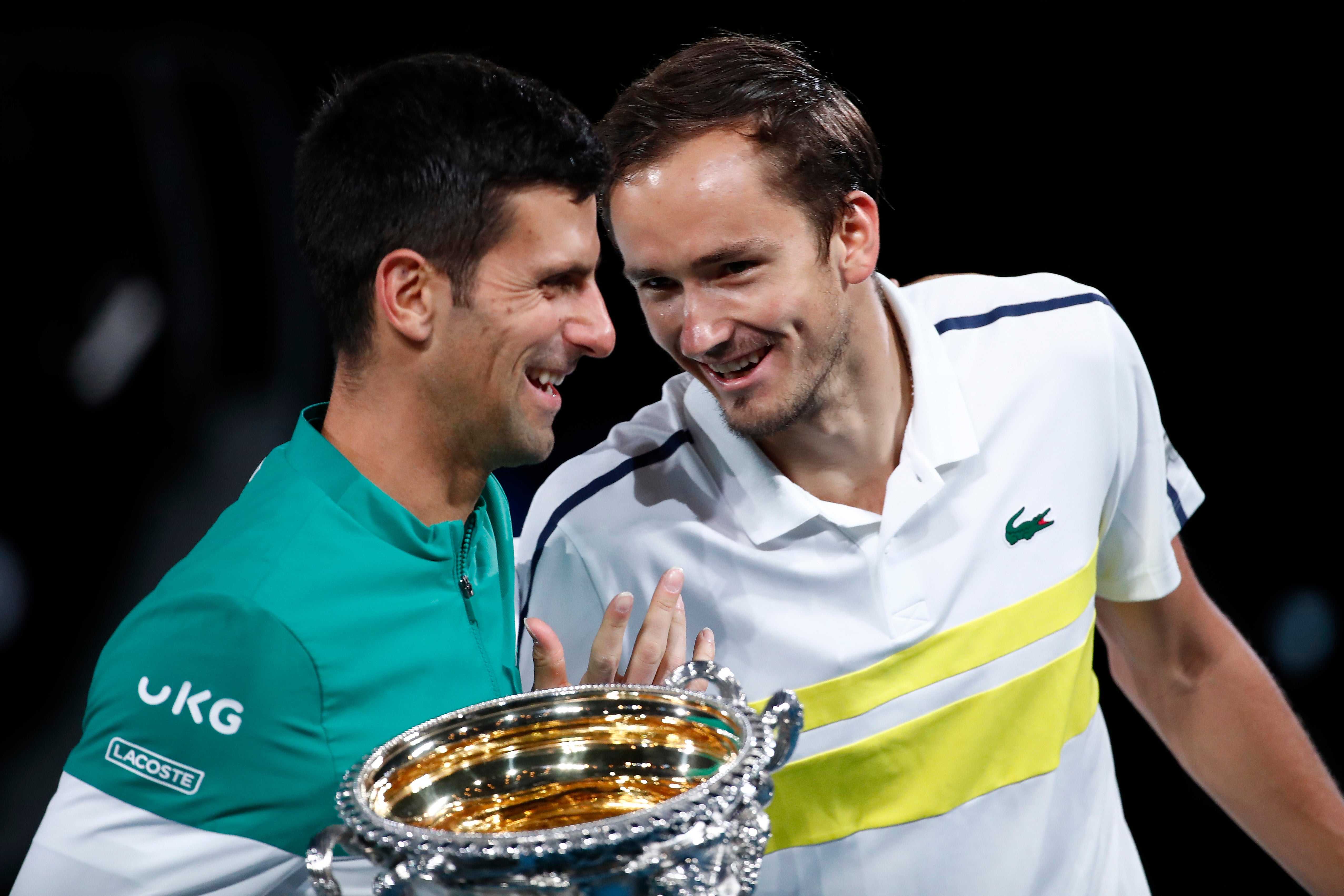 Runner-up Medvedev (right) shares a laugh with Djokovic