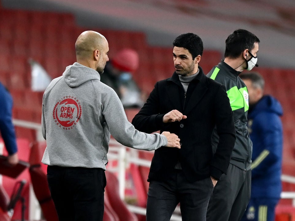 Pep Guardiola and Mikel Arteta bump fists at full time