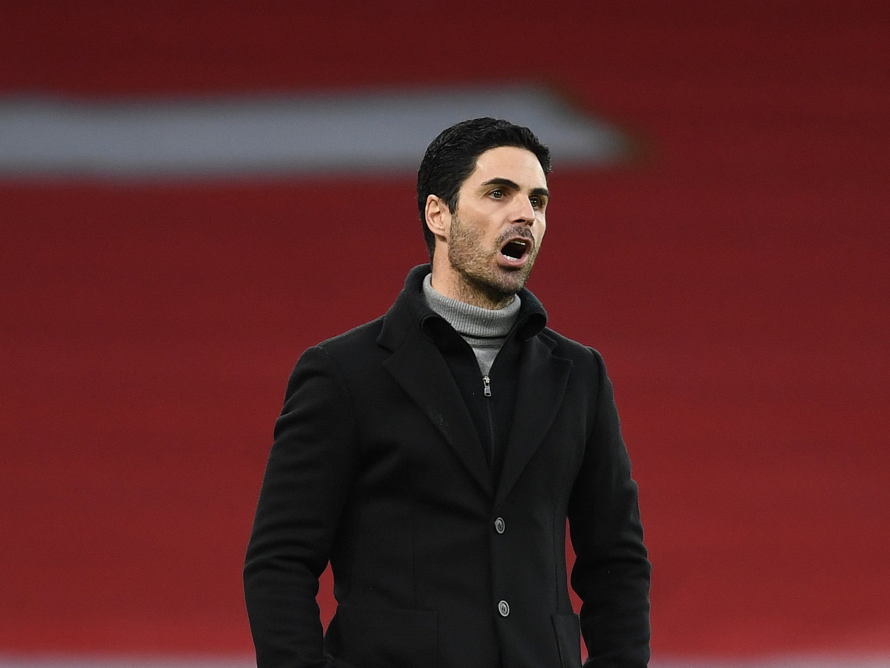 Mikel Arteta reacts during the match against Manchester City