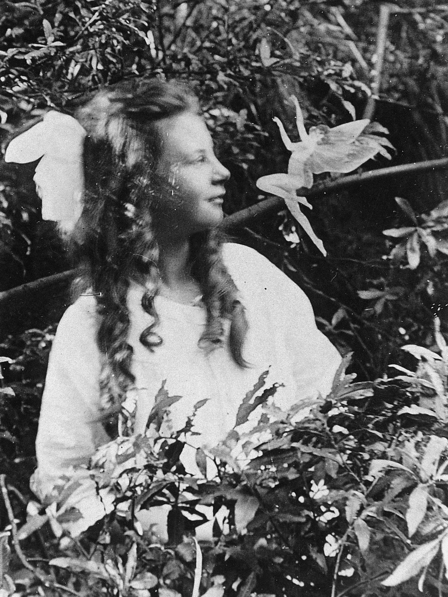 Frances and a leaping fairy, a photograph made in 1920 by Elsie