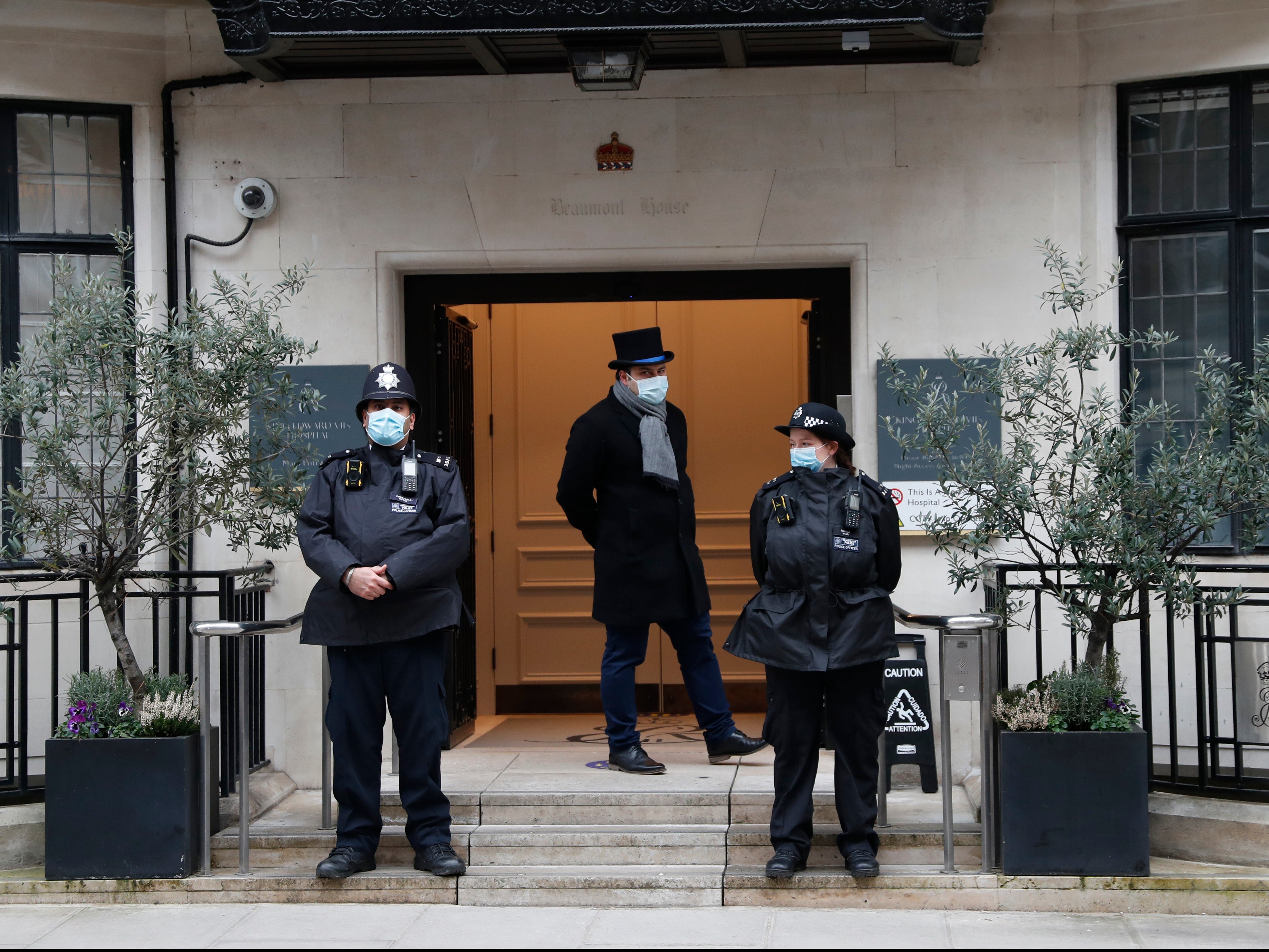 Police stand guard outside the King Edward VII’s Hospital in central London