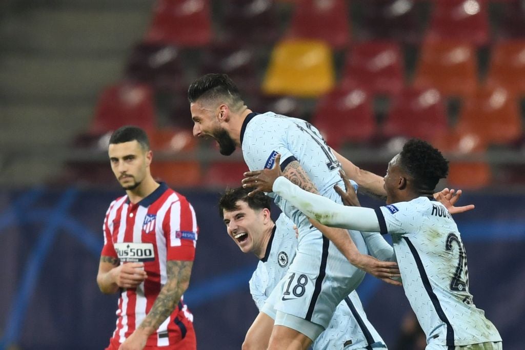 Giroud celebrates after finding a way through Atletico’s defence