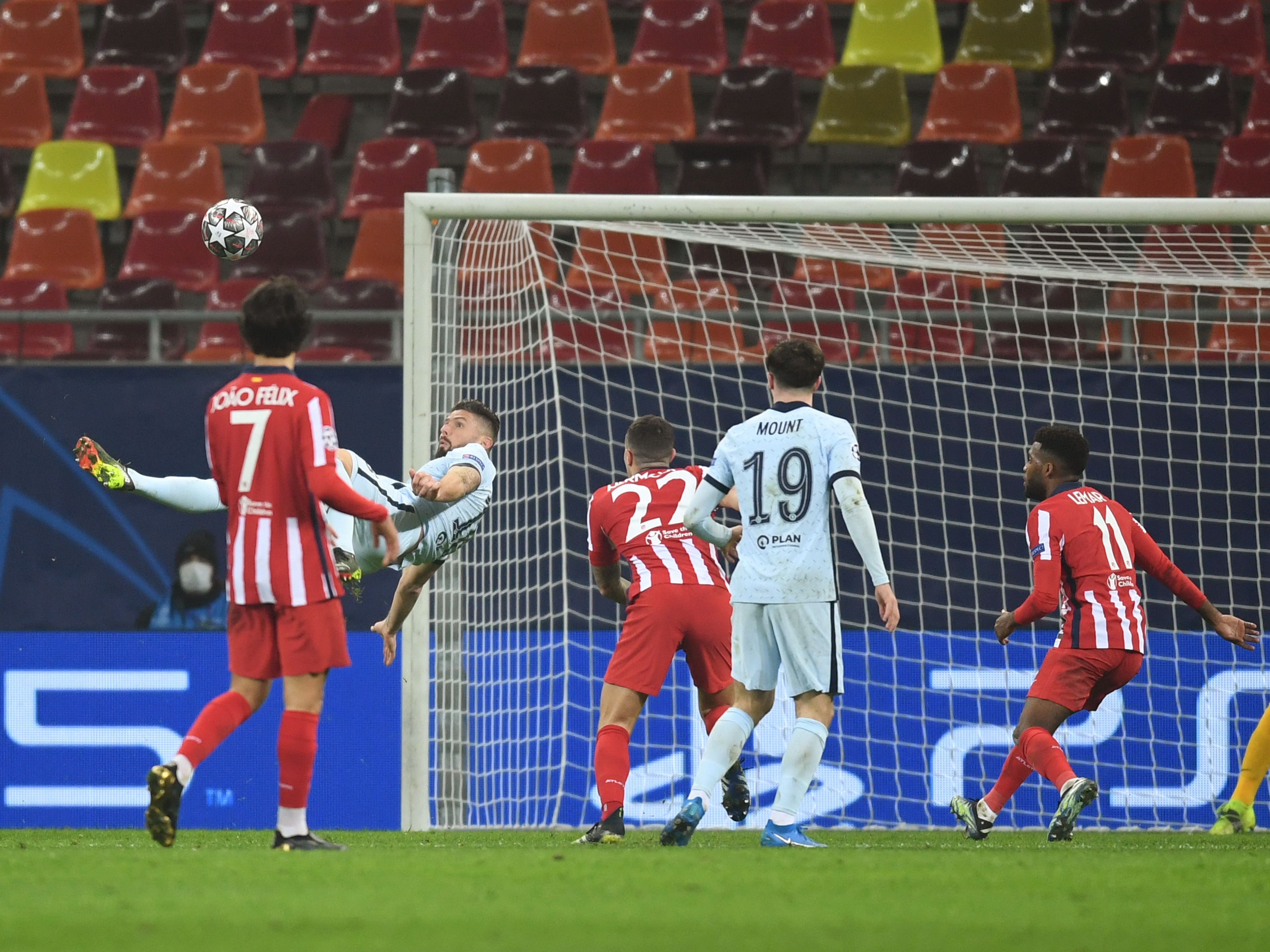 Olivier Giroud scores an overhead kick in the second half against Atletico Madrid