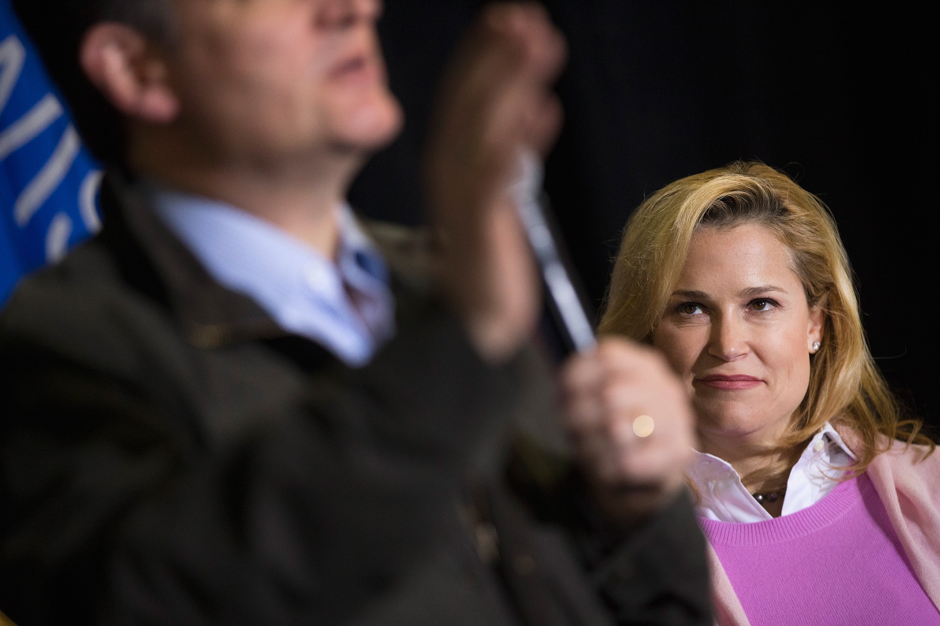 Cruz pictured listening to her husband in Dane, Wisconsin, in 2016 when she took an unpaid career break from Goldman Sachs to help him campaign