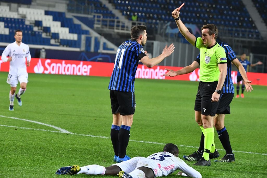 German referee Tobias Stieler gives a red card to Remo Freuler