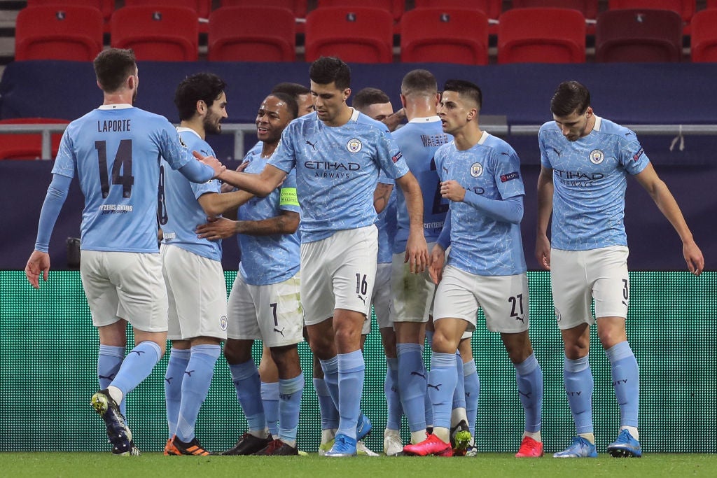 Man City celebrate scoring in the Champions League