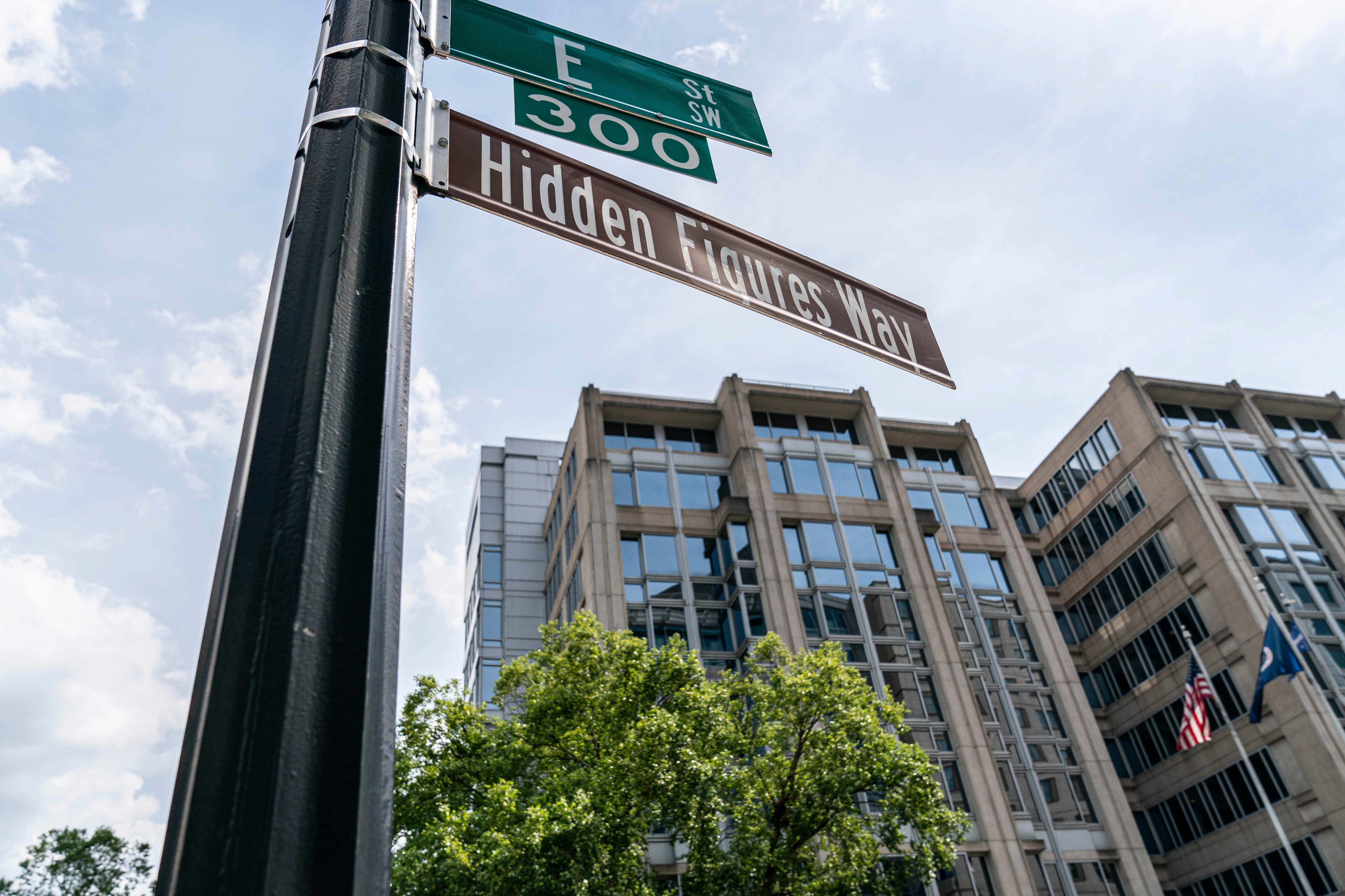 The street sign ‘Hidden Figures Way’ is posted at Nasa’s headquarters in honour of Black female mathematicians who worked at the administration on 26 June 2020 in Washington, DC. The headquarters building is being renamed to honour Mary Jackson and will be known as the Mary W Jackson Headquarters Building.