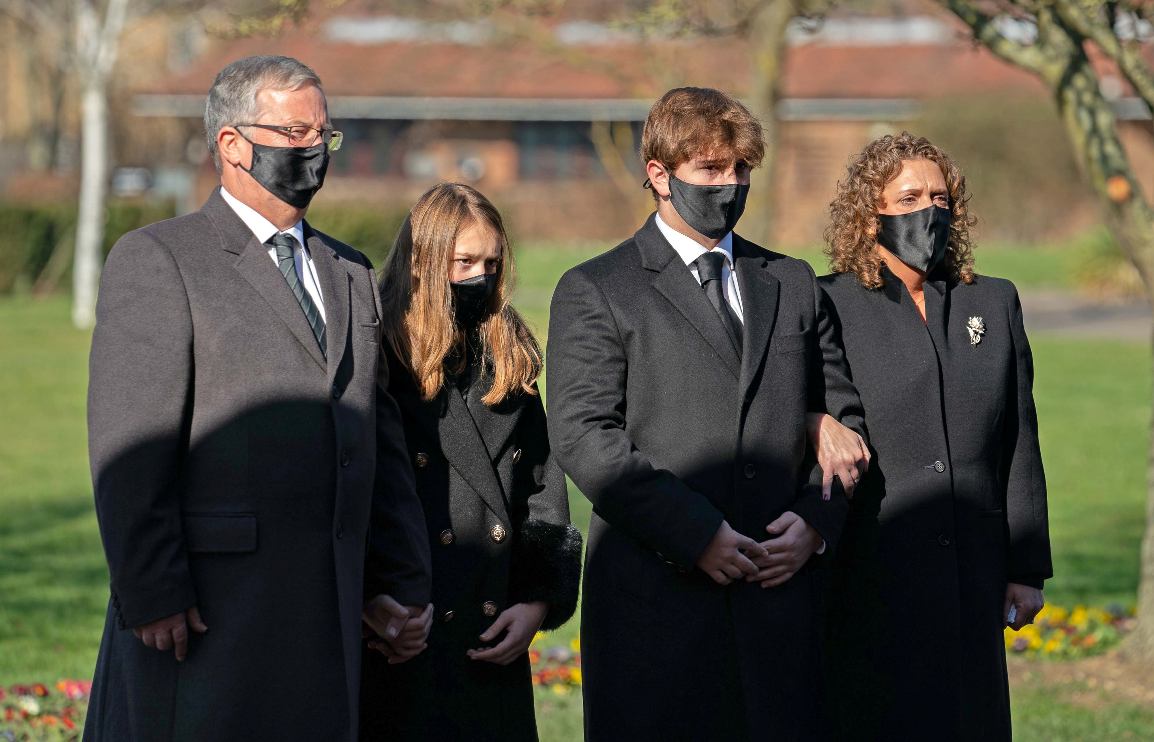 The family of Captain Sir Tom Moore (left to right) son-in-law Colin Ingram, granddaughter Georgia, grandson Benjie and daughter Hannah Ingram-Moore arrive for his funeral