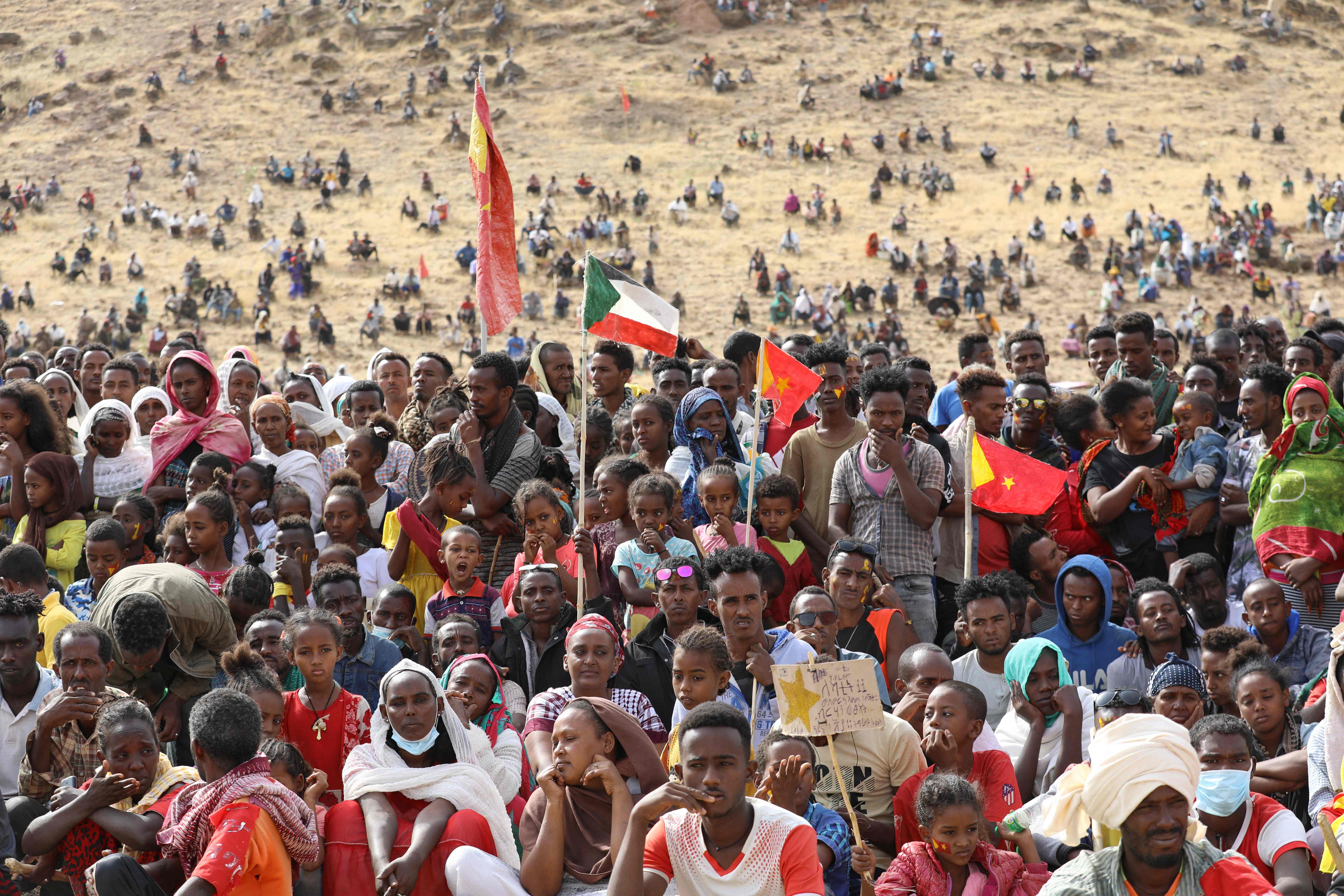 Ethiopian refugees gather to celebrate the 46th anniversary of the Tigray People's Liberation Front at Um Raquba refugee camp in Gedaref, eastern Sudan, on 18 February 2021