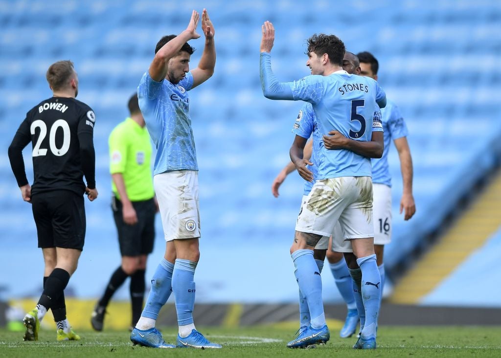 Manchester City celebrate defeating West Ham