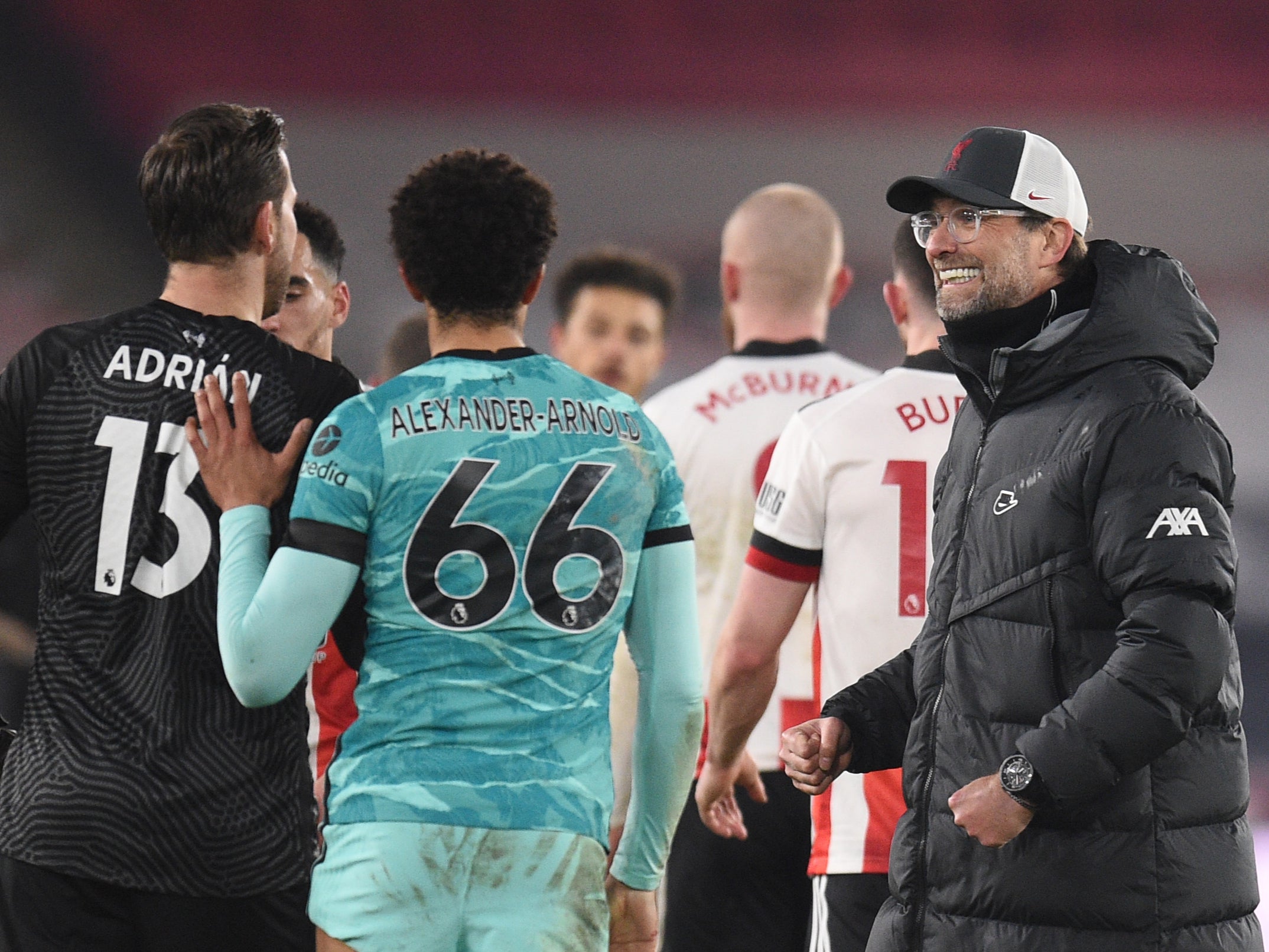 Liverpool manager Jurgen Klopp with Trent Alexander-Arnold and Adrian