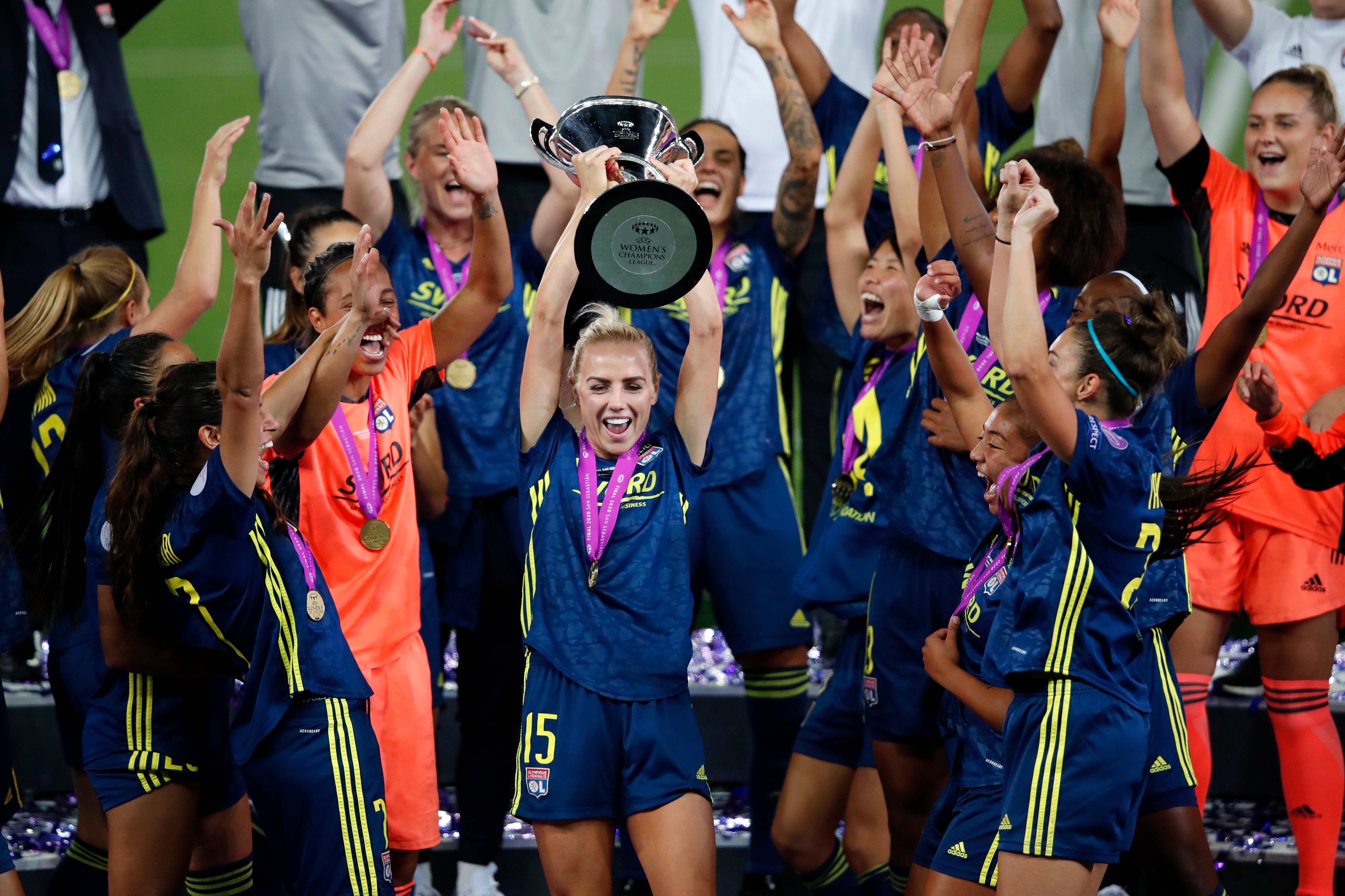 Alex Greenwood celebrates winning the Champions League with Lyon