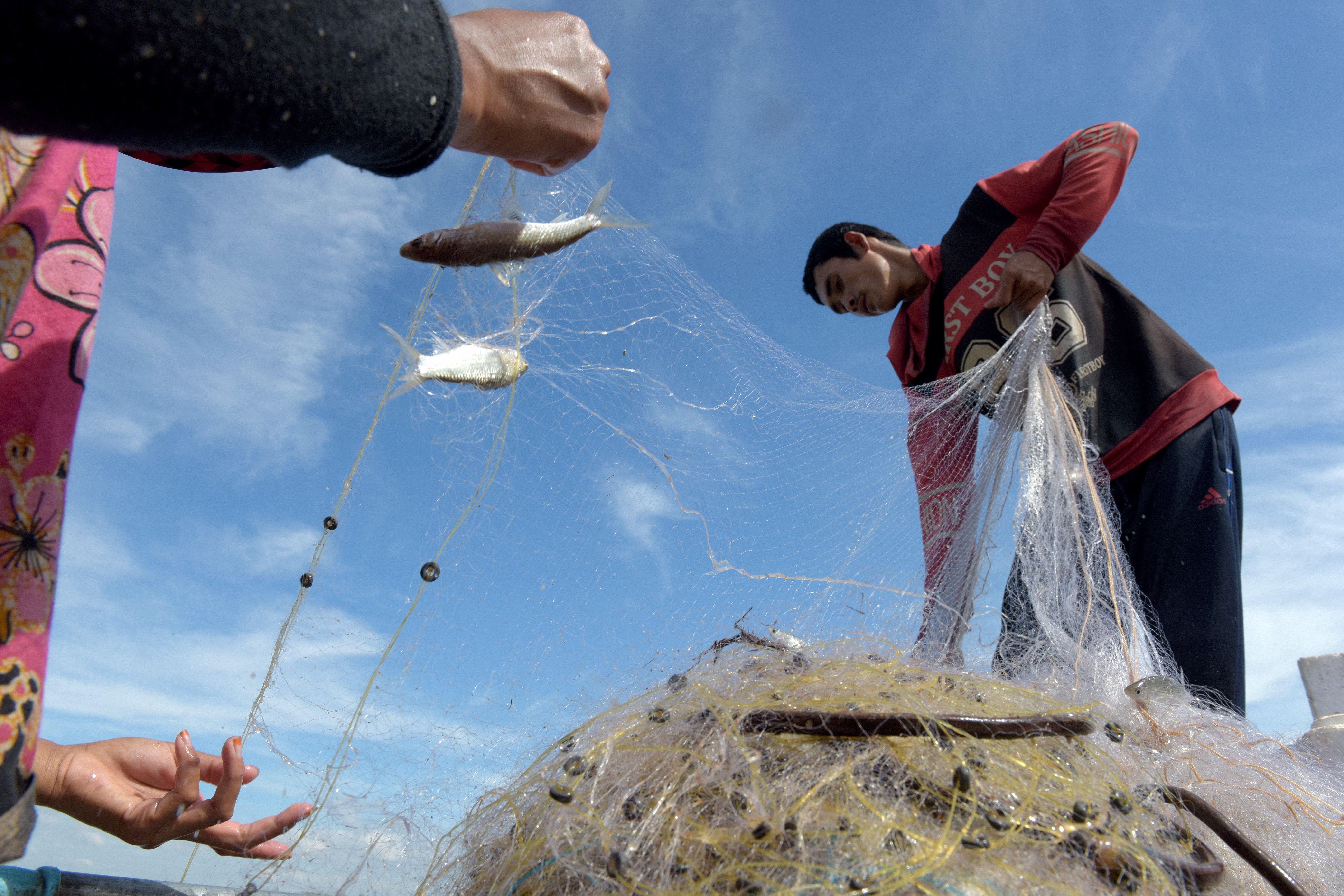 Cambodian fisherman Sles Hiet lives at the mercy of the Mekong