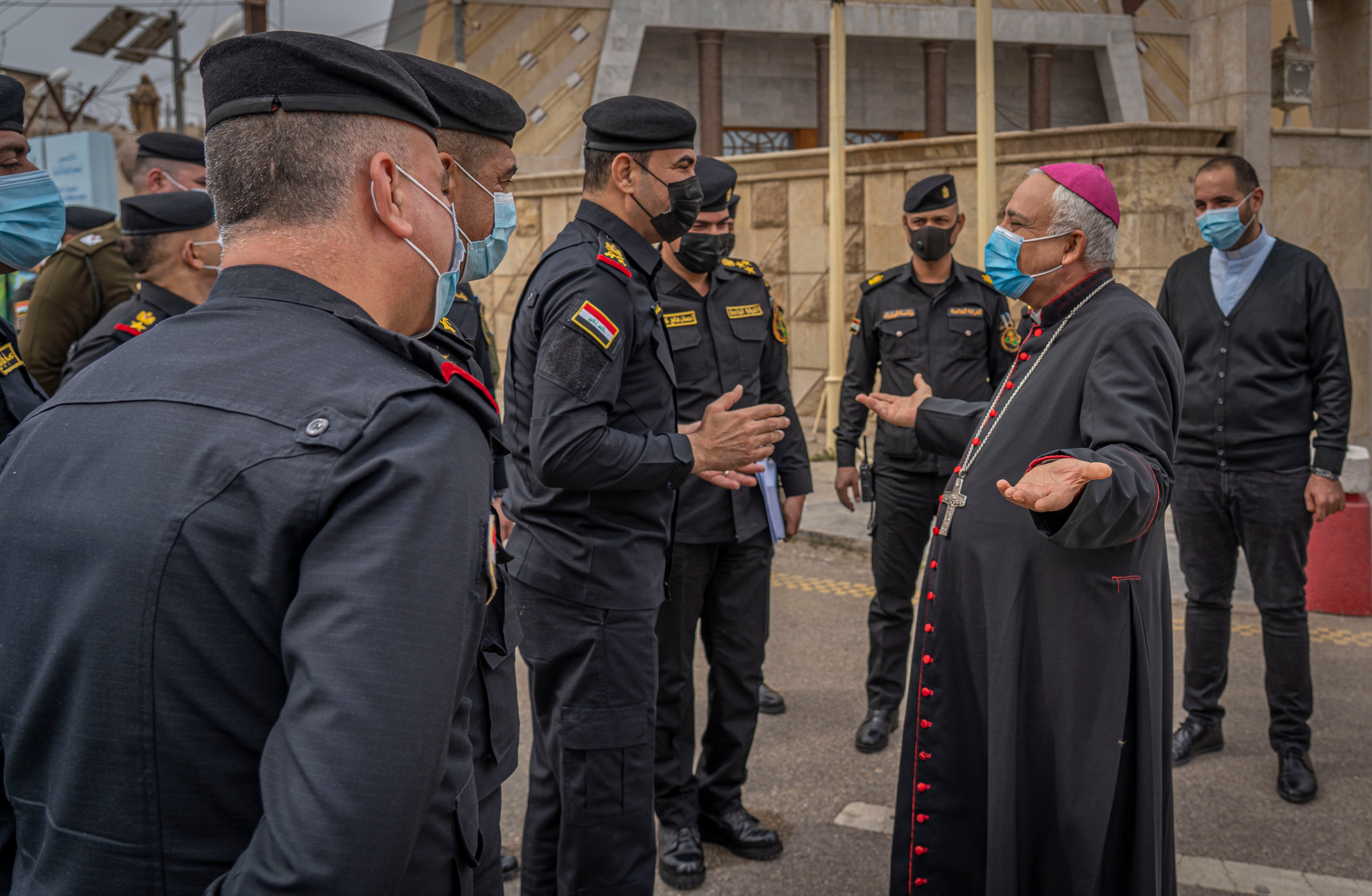 Major General Hamad al-Zuhairy, commander of the Iraqi Special Operations forces, chats to a cleric in Baghdad