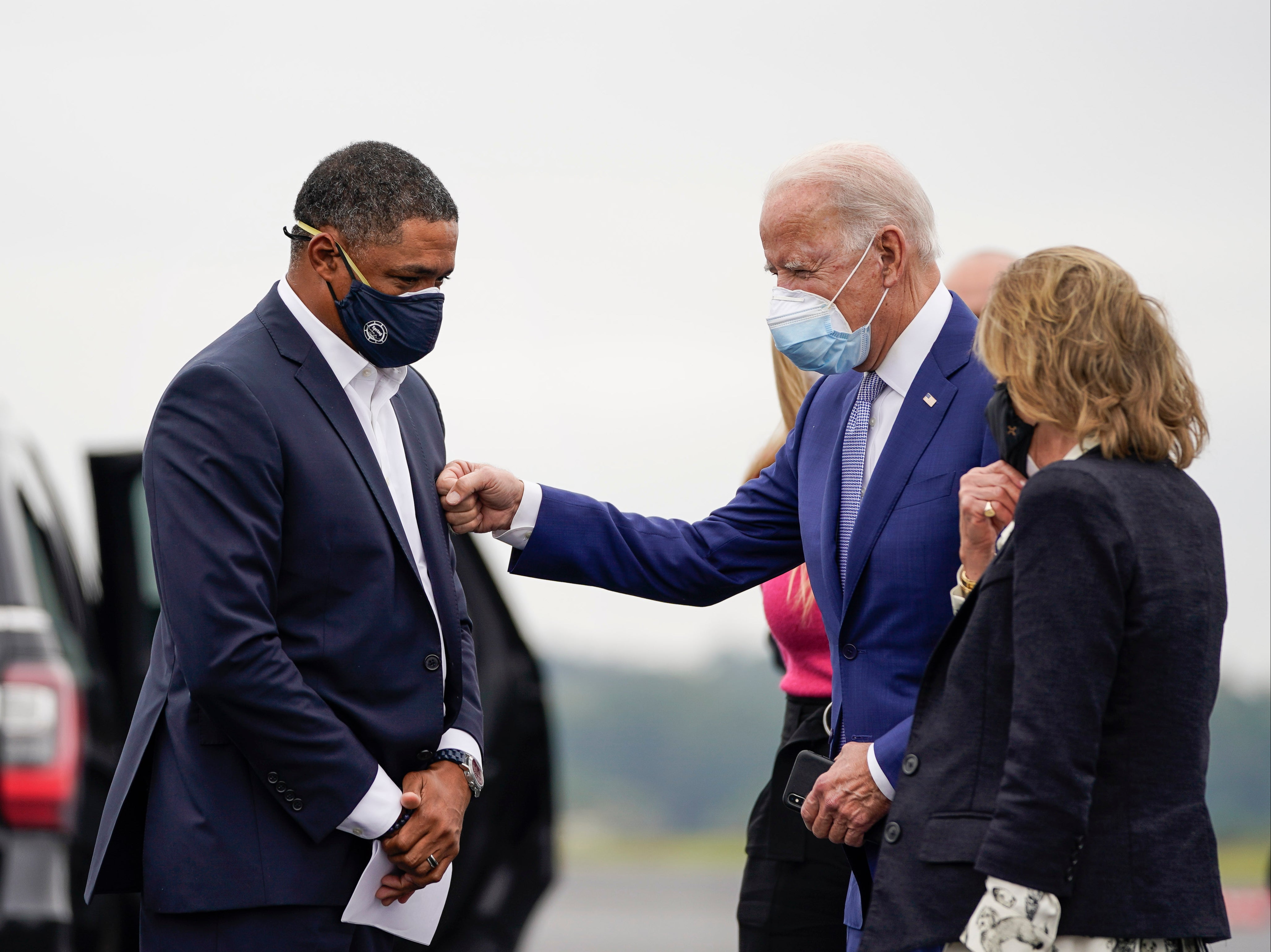 Cedric Richmond (D-LA) and Democratic presidential nominee Joe Biden greet each other as Biden arrives at Columbus Airport on 27 October 2020 in Columbus, Georgia