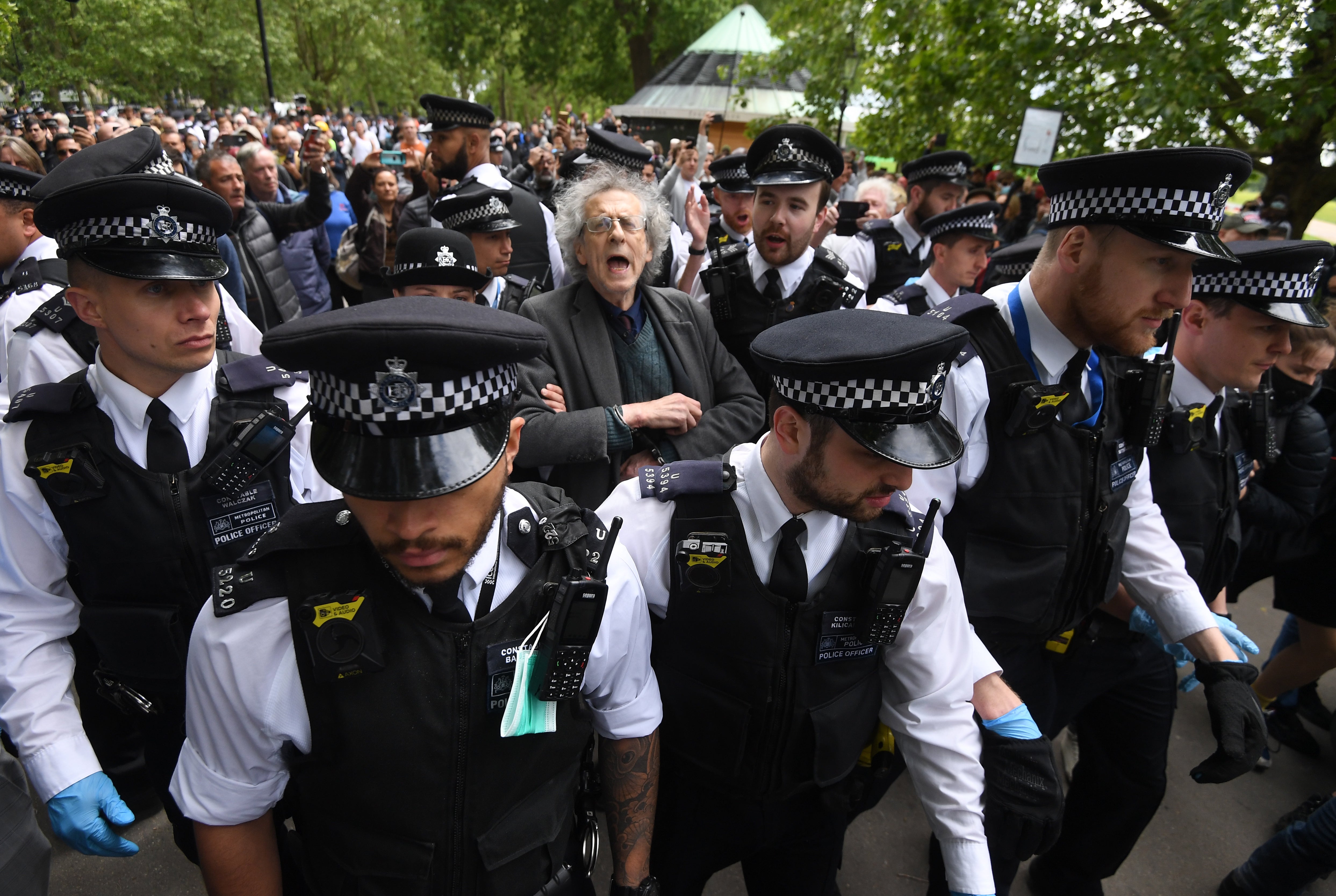 Piers Corbyn is led away by police during a protest in London’s Hyde Park in May 2020