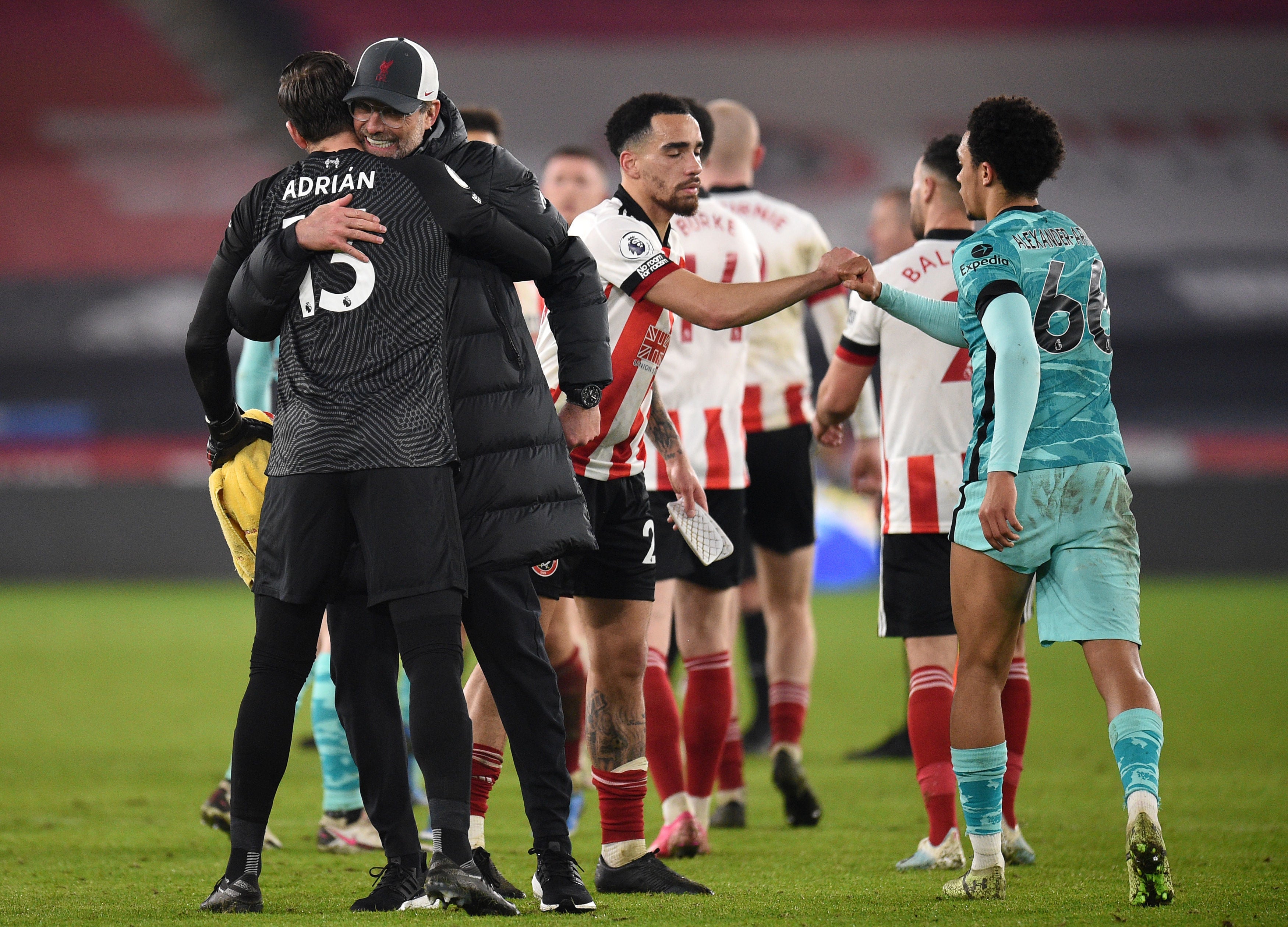 Jurgen Klopp embraces stand-in goalkeeper Adrian