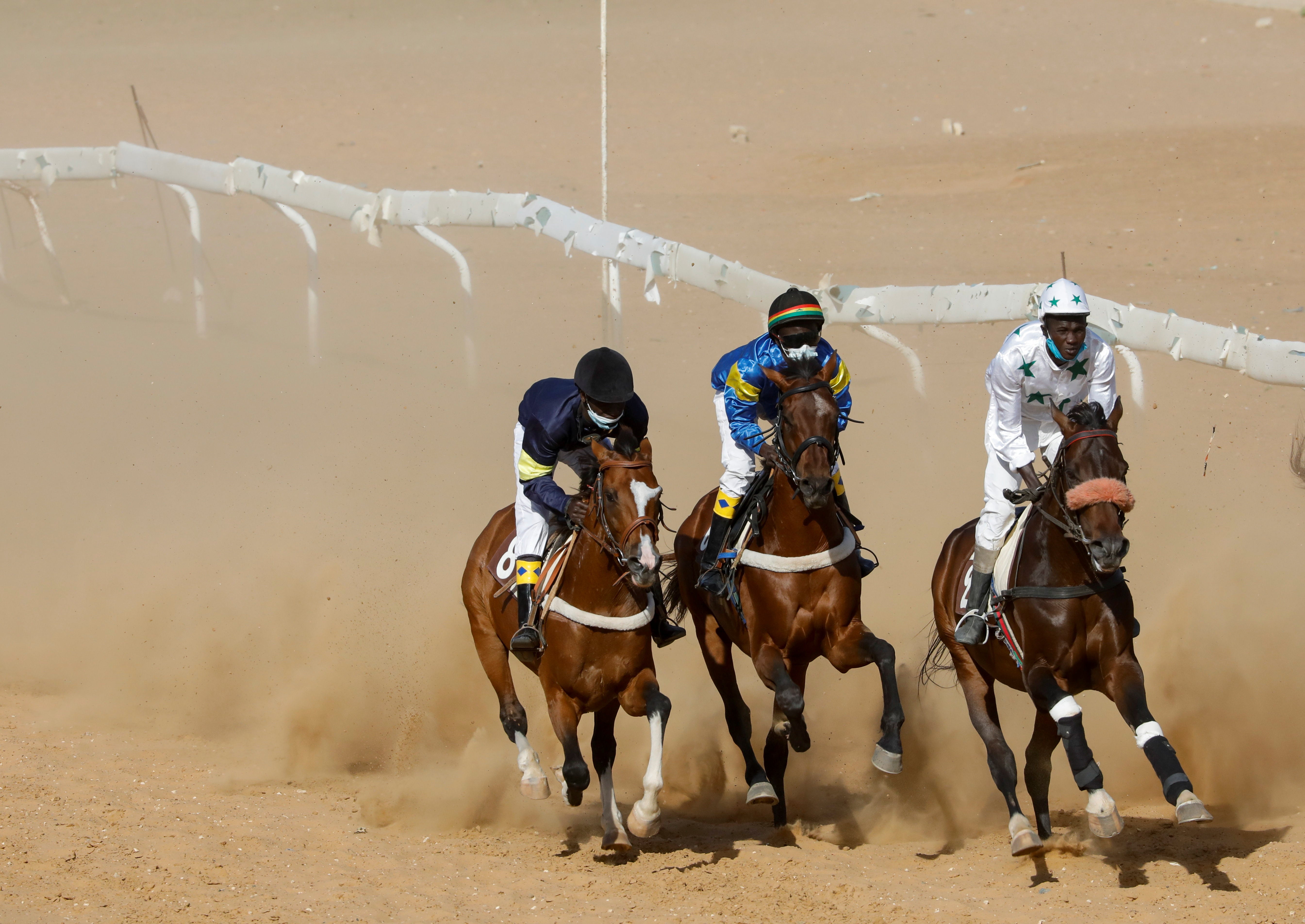 Diop, centre, riding to victory